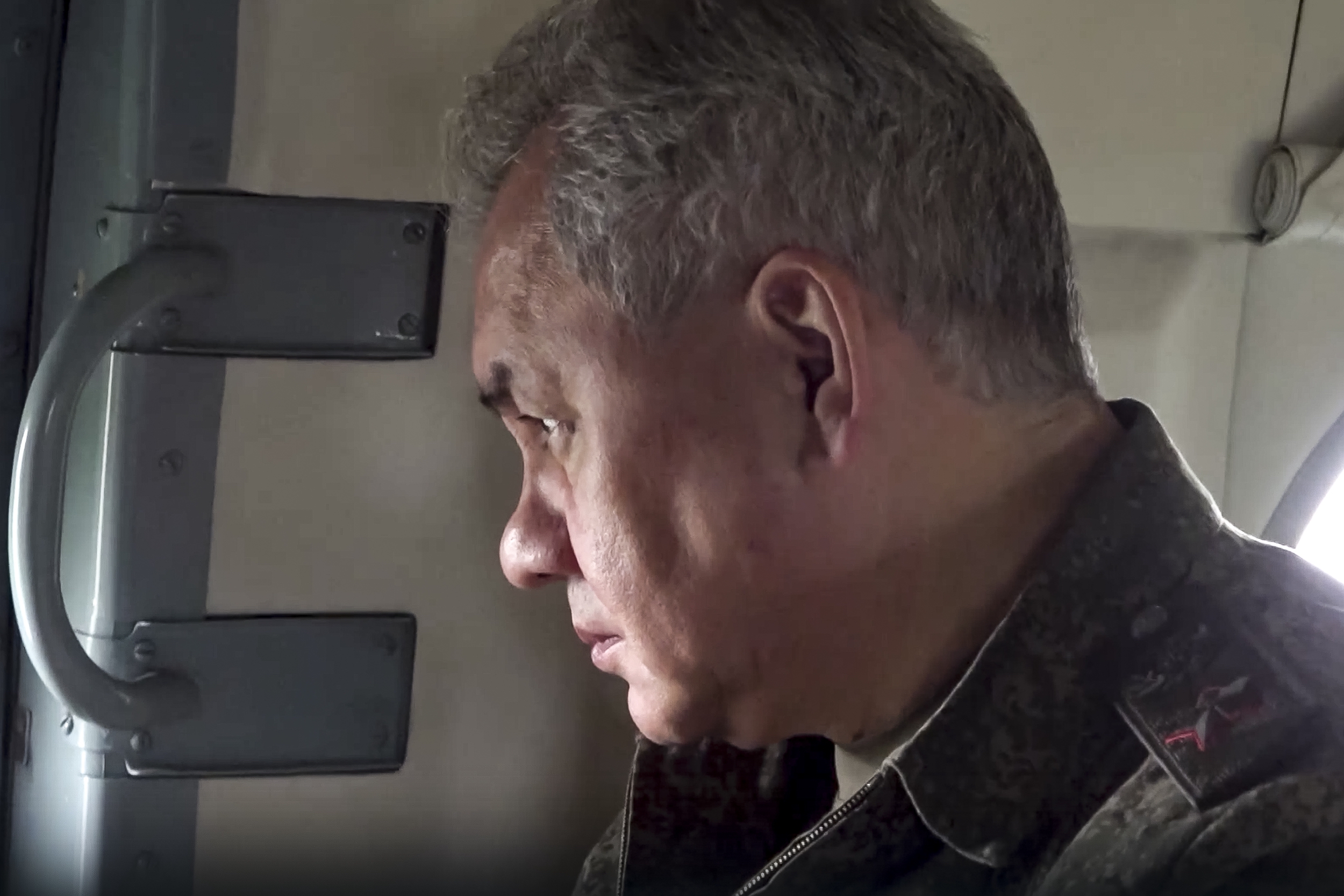 Russian Defence Minister Sergei Shoigu on board a military helicopter on his way to inspect a command post of one of the formations of the Zapad (West) group of Russian troops at an undisclosed location in Ukraine. Photo / AP