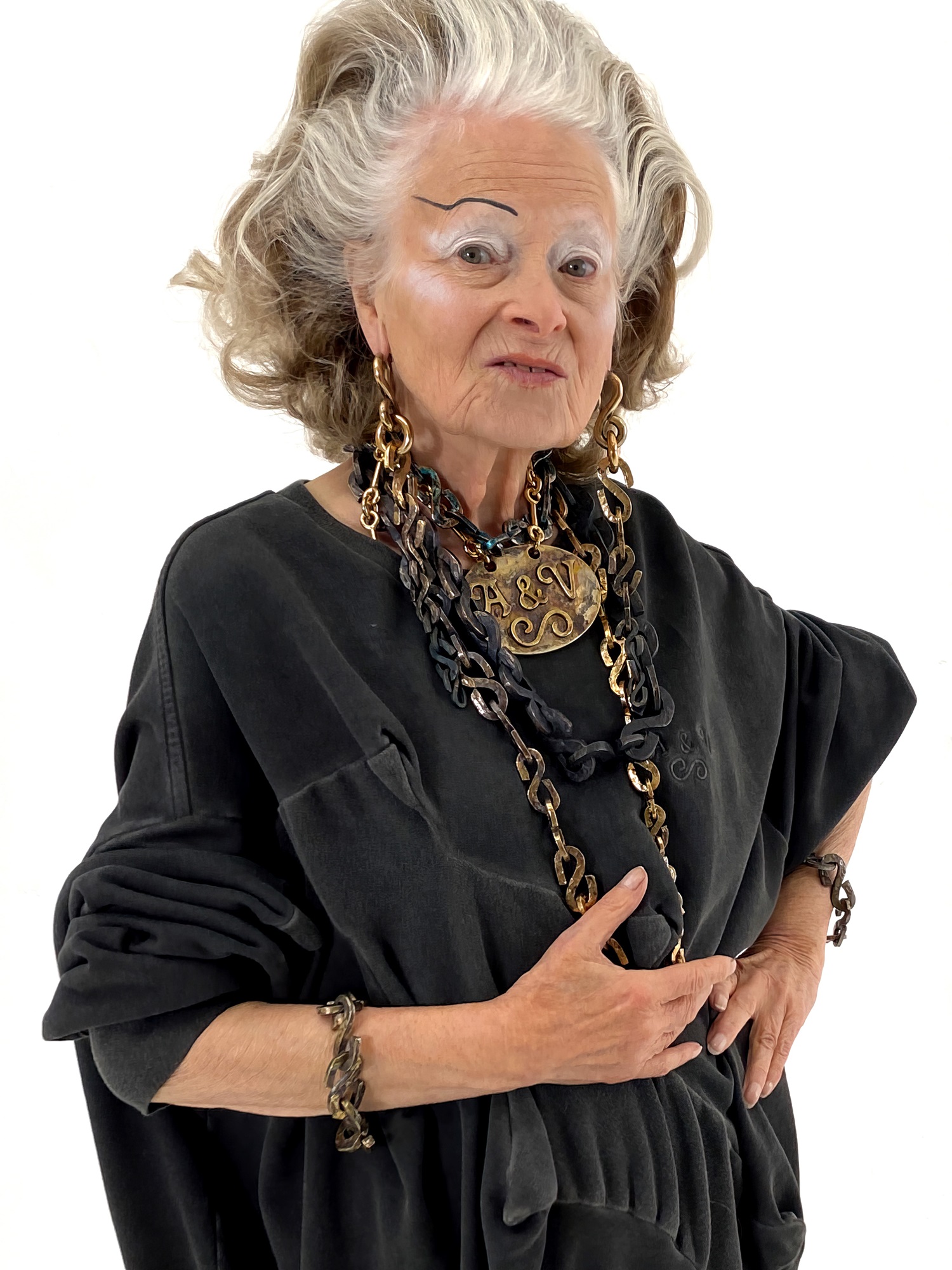 The late Dame Vivienne Westwood wearing Andreas Kronthaler for Vivienne Westwood jewellery.
