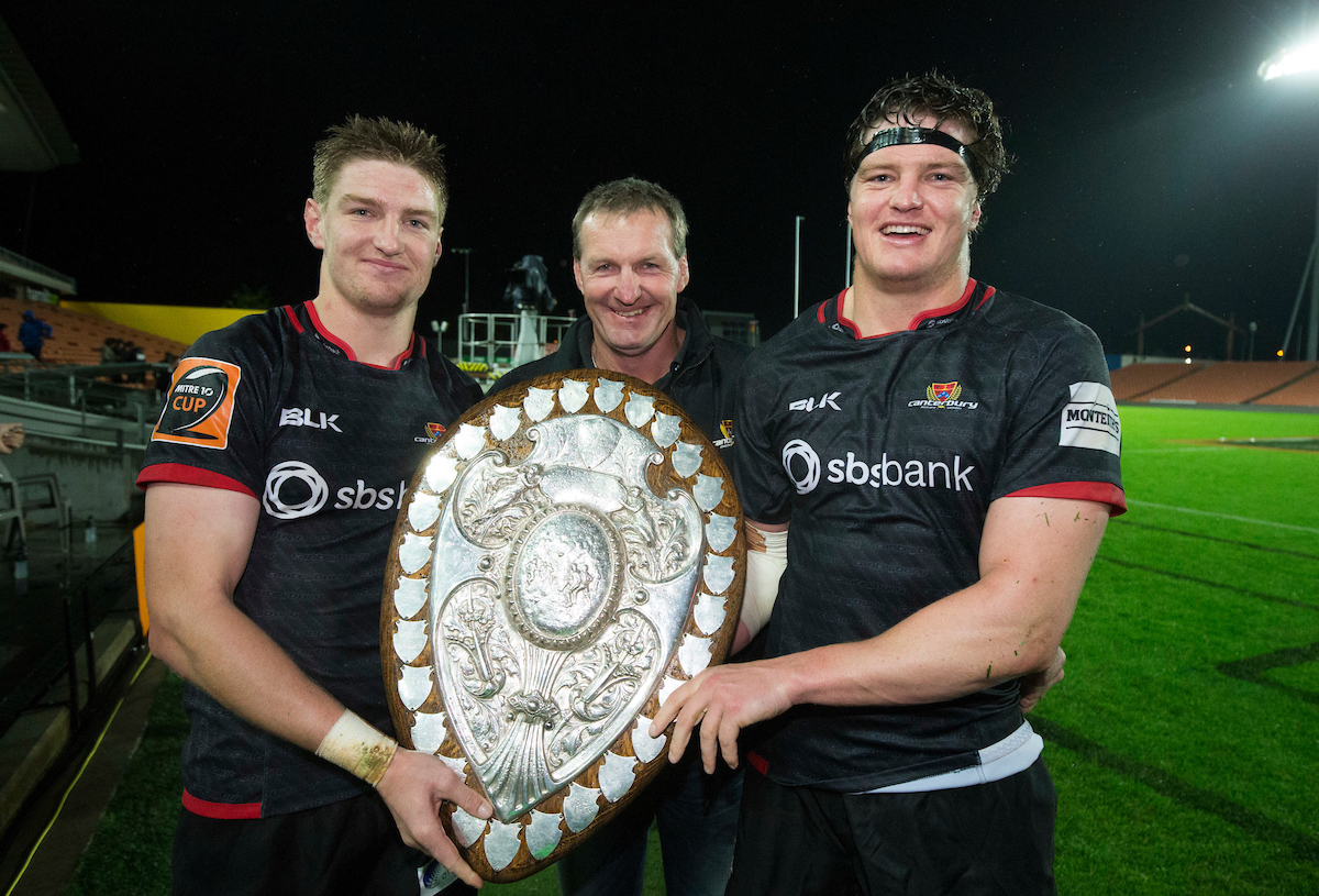 Jordie Barrett (left) with father Kevin and brother Scott holding the Ranfurly Shield. Photo / Photosport