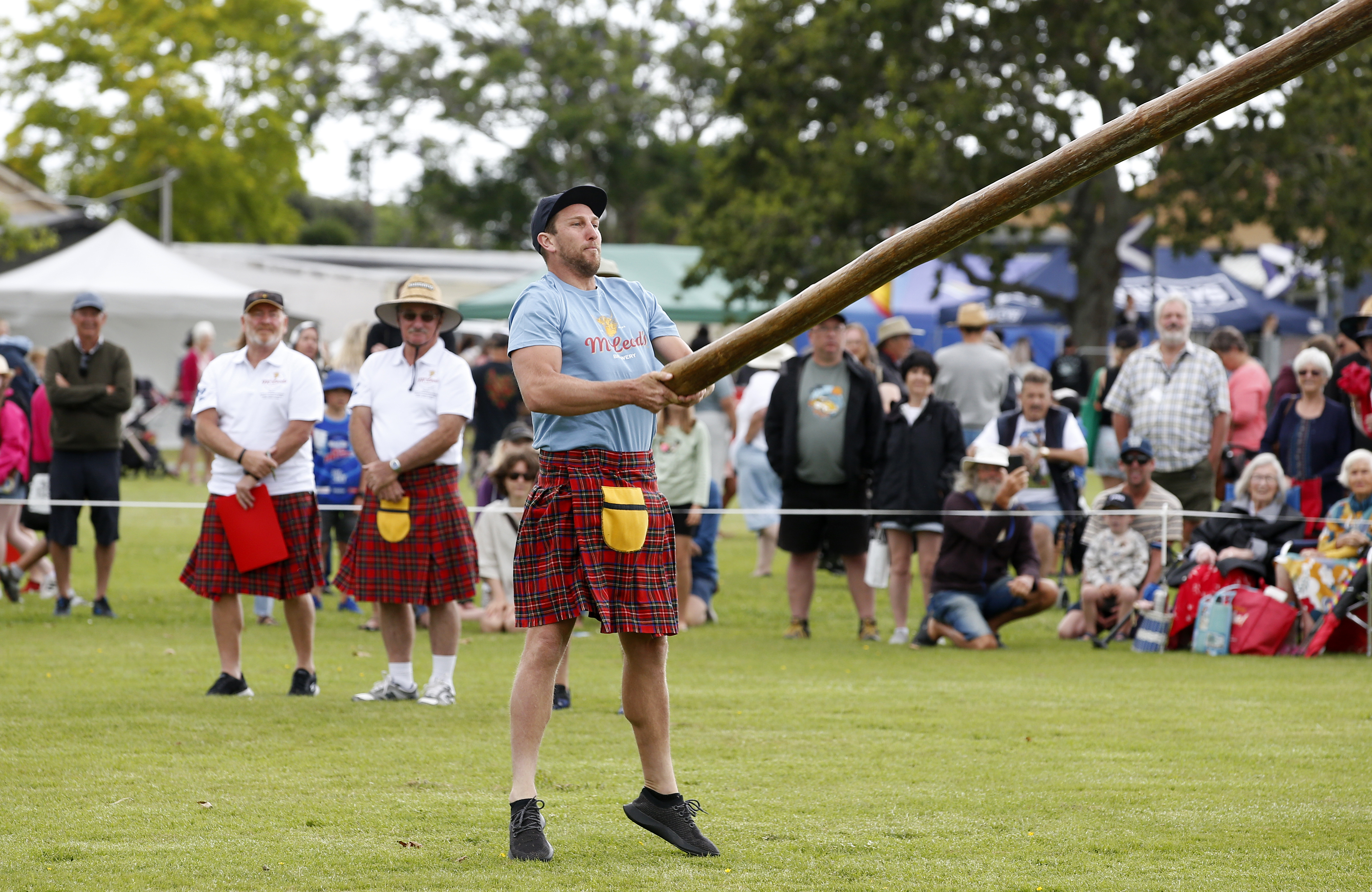 The caber toss, demonstrated here by Gilbert Costello, is one of the numerous heavy weight competitions which provide plenty of entertainment. Photo / Michael Cunningham