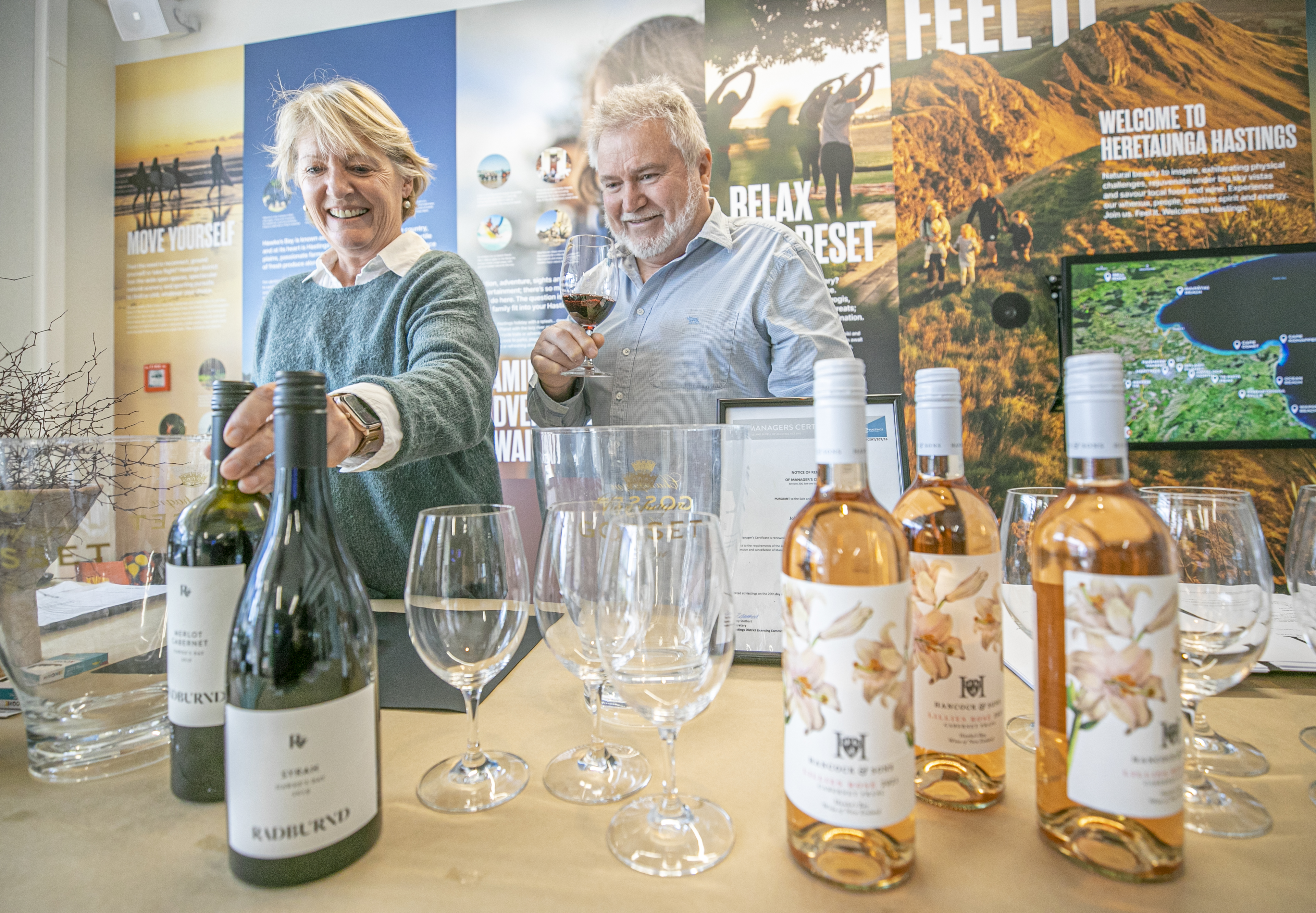 Hawke’s Bay winemakers Kate Radburnd and John Hancock with their wines at a pop-up cellar door at Hastings i-Site. Photo / Warren Buckland