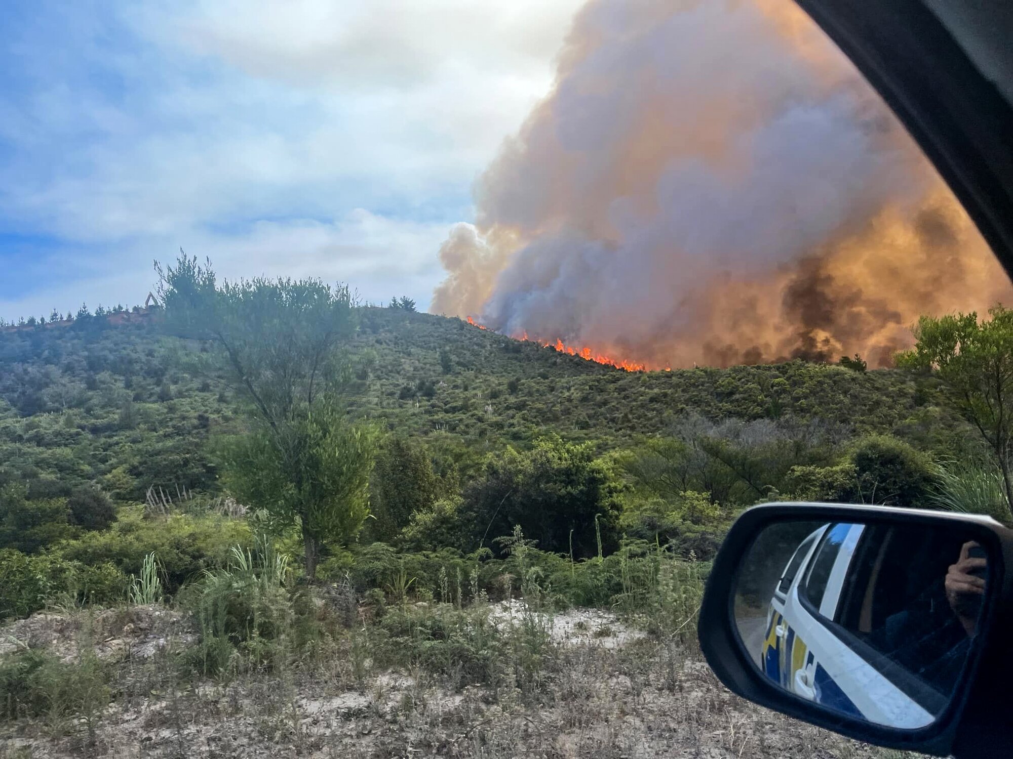 Flames and smoke from a scrub fire in the Waipoua Forest. Photo / Supplied