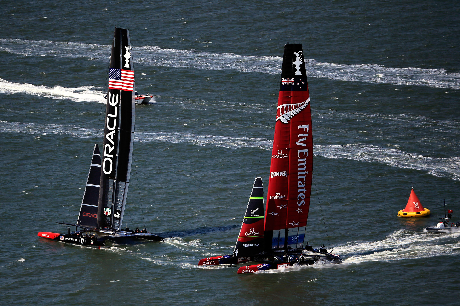 Oracle Team USA rounds the second mark ahead of Emirates Team NZ in race five. Photo / Getty Images.