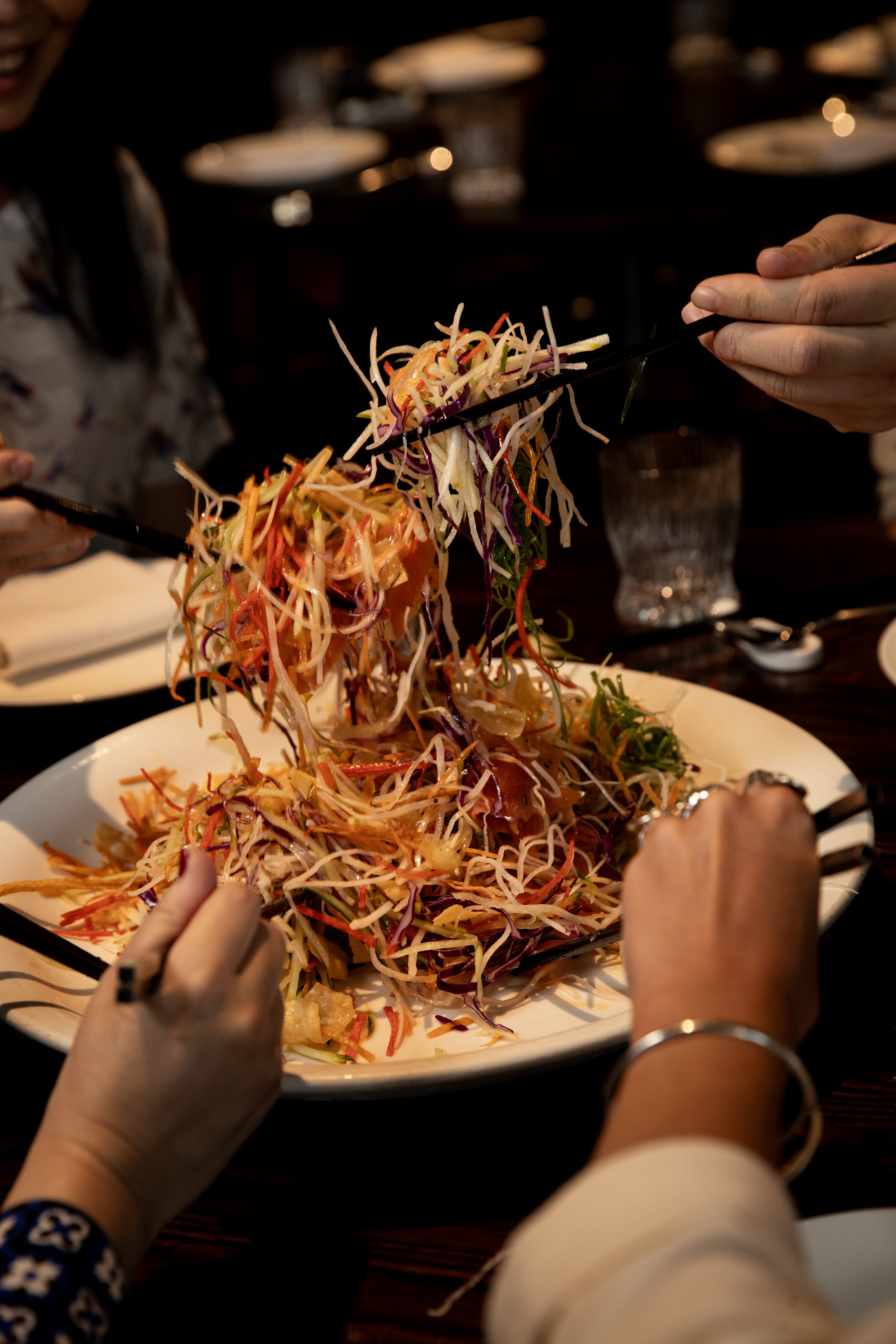 Yusheng prosperity salad from Huami Restaurant SkyCity — the higher your toss the better your fortune. Photo / Dean Purcell