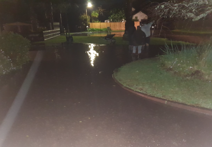 Flooding at this Huapai home entered the garage, soaking carpet, twice during the night. Photo / Supplied