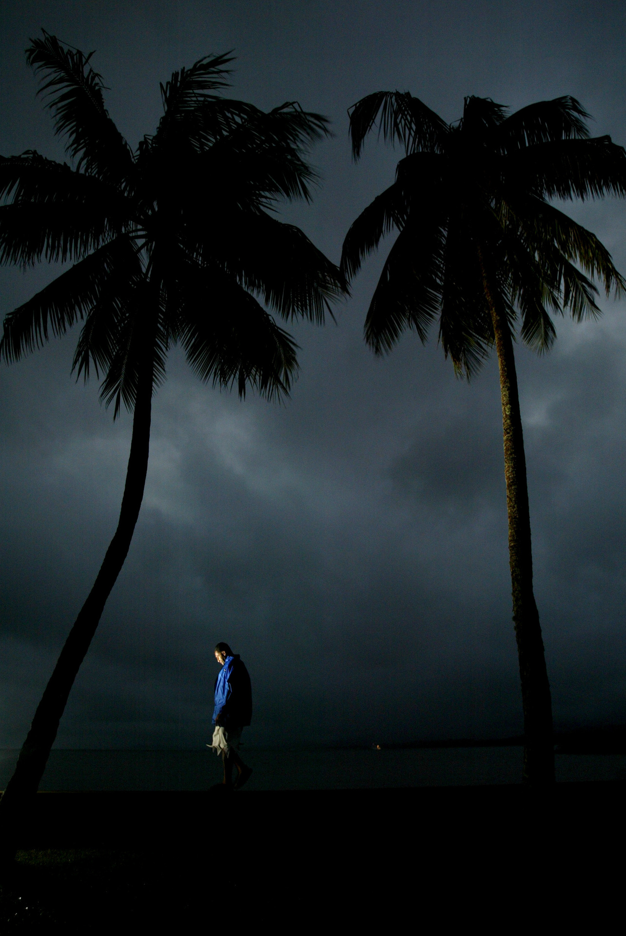 A security guard patrols a sea wall in Fiji. Drugs arrests in Fiji have increased markedly in recent years. Photo / NZME