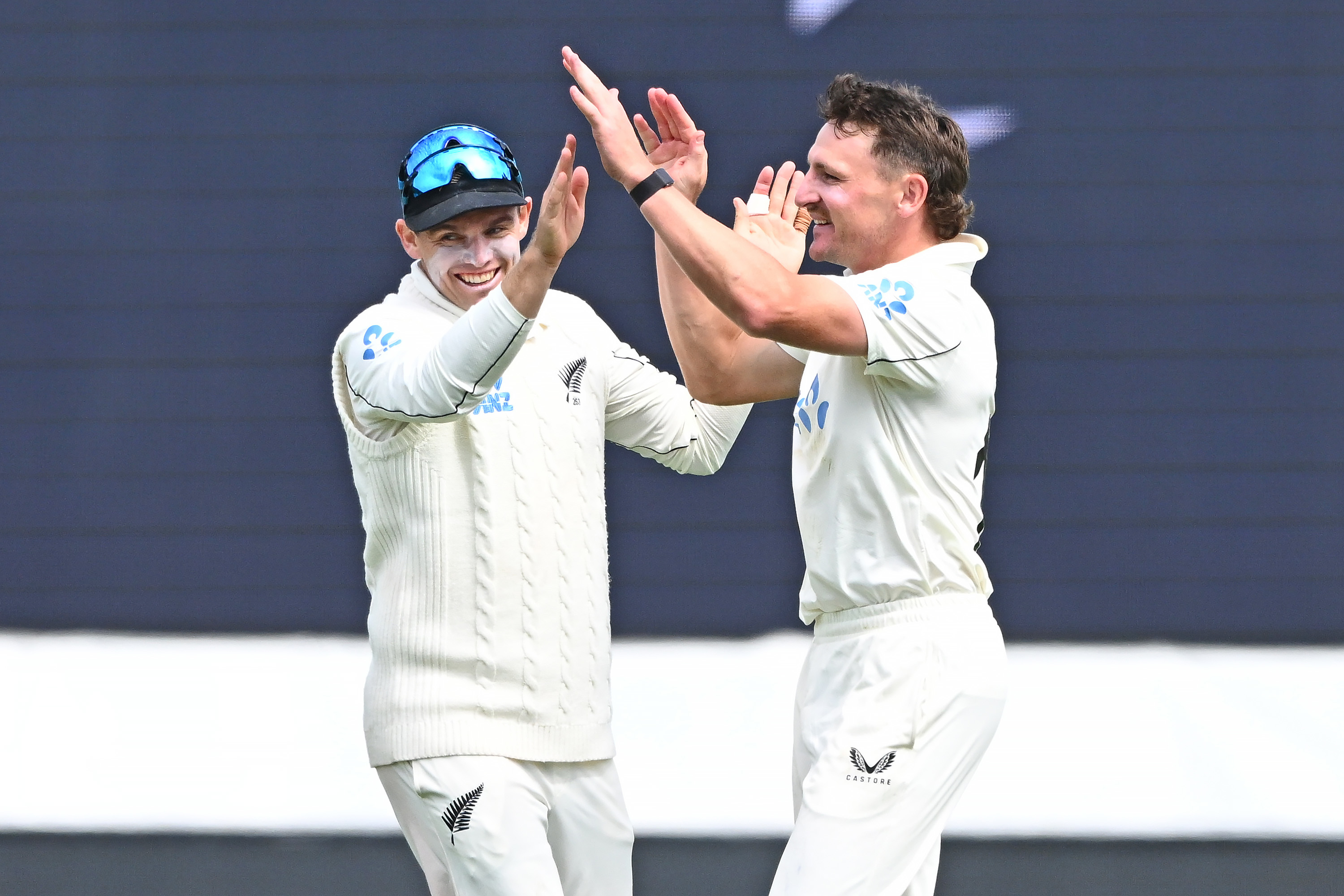 Tom Latham and Nathan Smith celebrate the run out of England's Harry Brook. Photo / Photosport