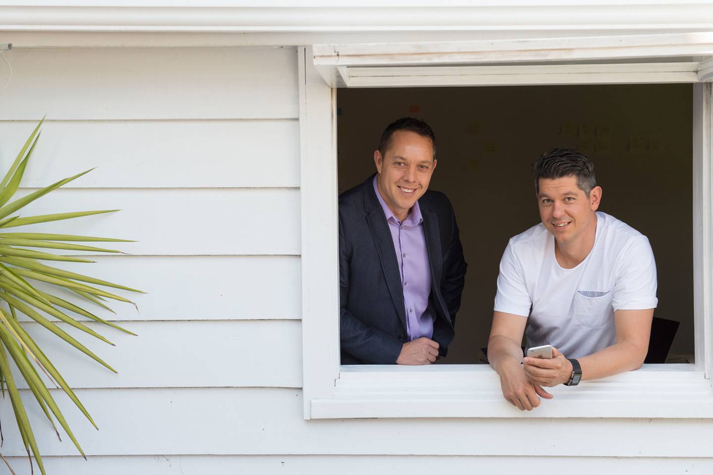 AskNicely cofounders Aaron Ward (left) and John Ballinger, pictured in 2015 in the garden shed where they started their business. Photo / Supplied