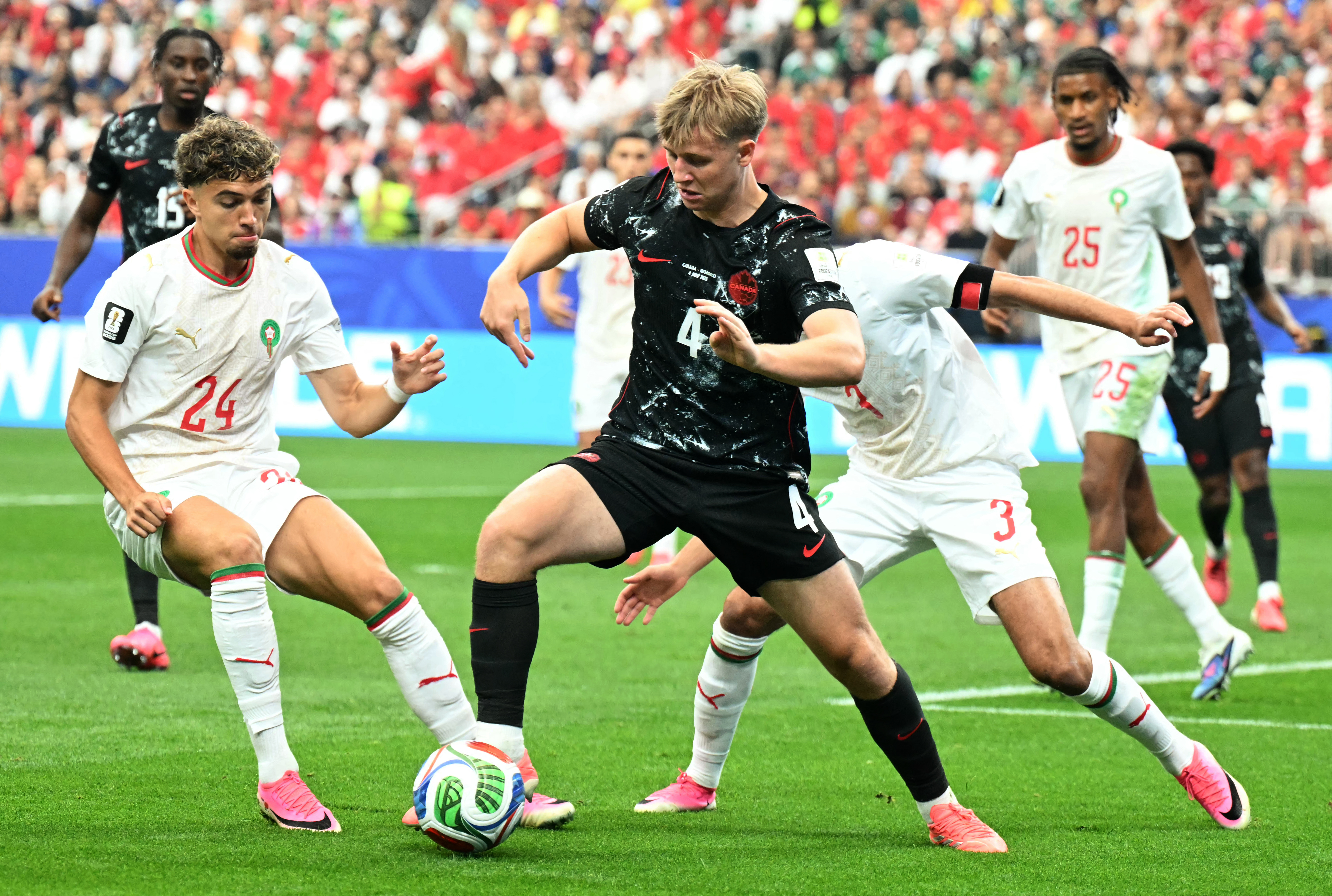 Luc de Fougerolles with the ball against Morocco. Photo / AFP