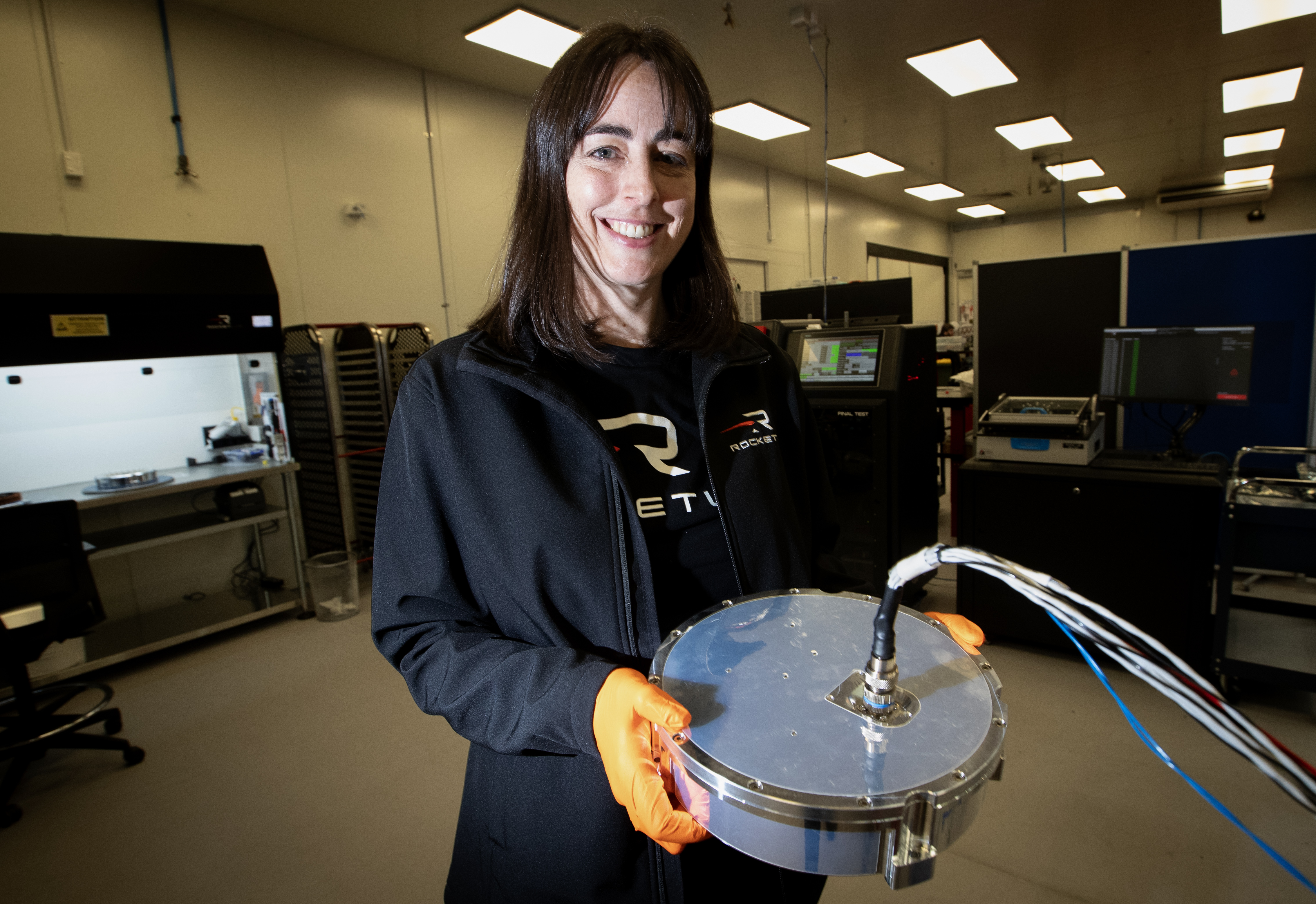 Janelle Keeble, Rocket Lab principal manufacturing engineer holds a reaction wheel. Photo / Jason Oxenham
