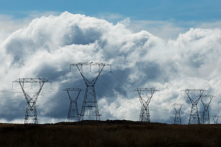 Electricity power pylons stand near the State Highway 1 Desert Road in Waiouru. Photo / Hagen Hopkins