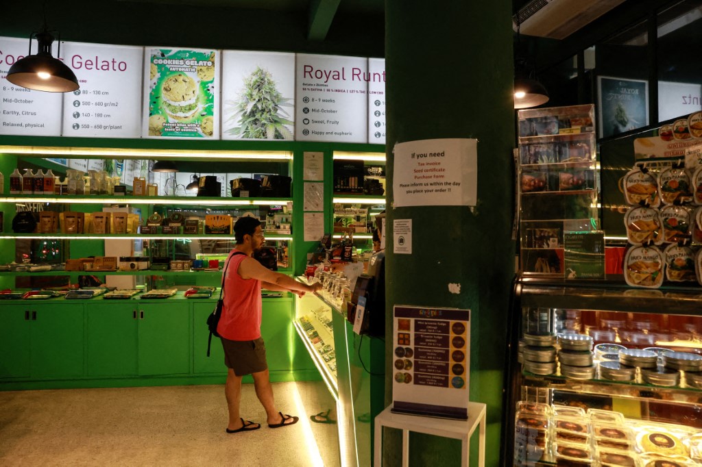 A customer stands by the counter inside a cannabis store in Bangkok, Thailand, which in 2022 became the first Asian country to legalise recreational cannabis. Photo / Valeria Mongelli, Hans Lucas via AFP