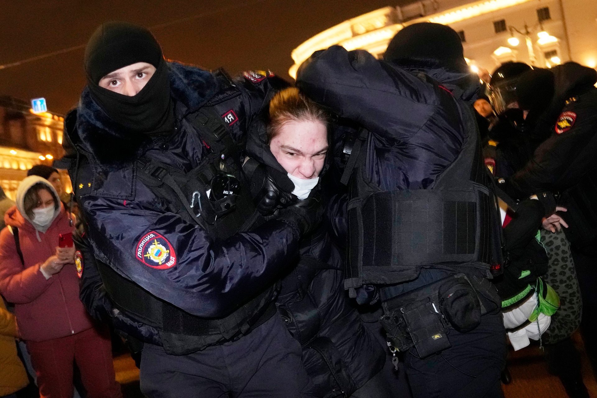 Police officers detain a man in St Petersburg at a protest against Russia's invasion of Ukraine. Photo / AP