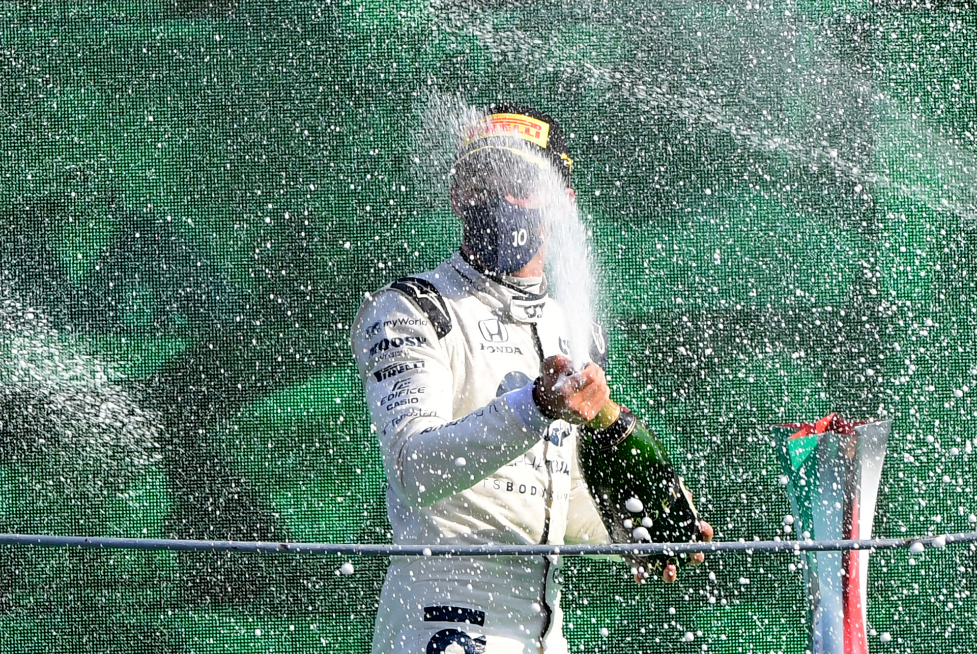 AlfaTauri driver Pierre Gasly of France sprays champagne and celebrates on the podium after winning the Italian Formula One Grand Prix at the Monza racetrack. photo / AP