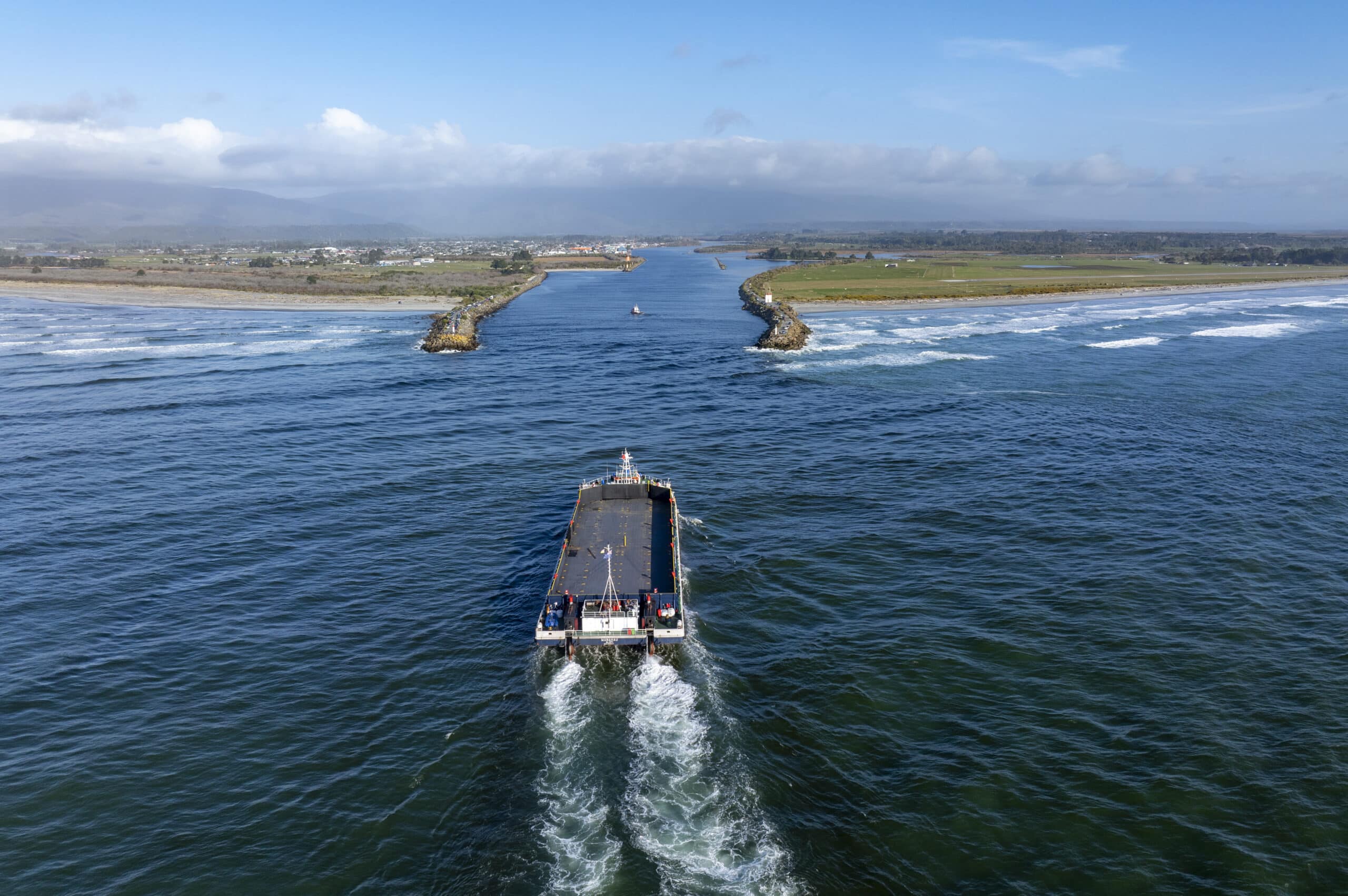 Westland Mineral Sands uses the barge the Manahau to transfer its heavy mineral concentrate to transport vessels at sea.