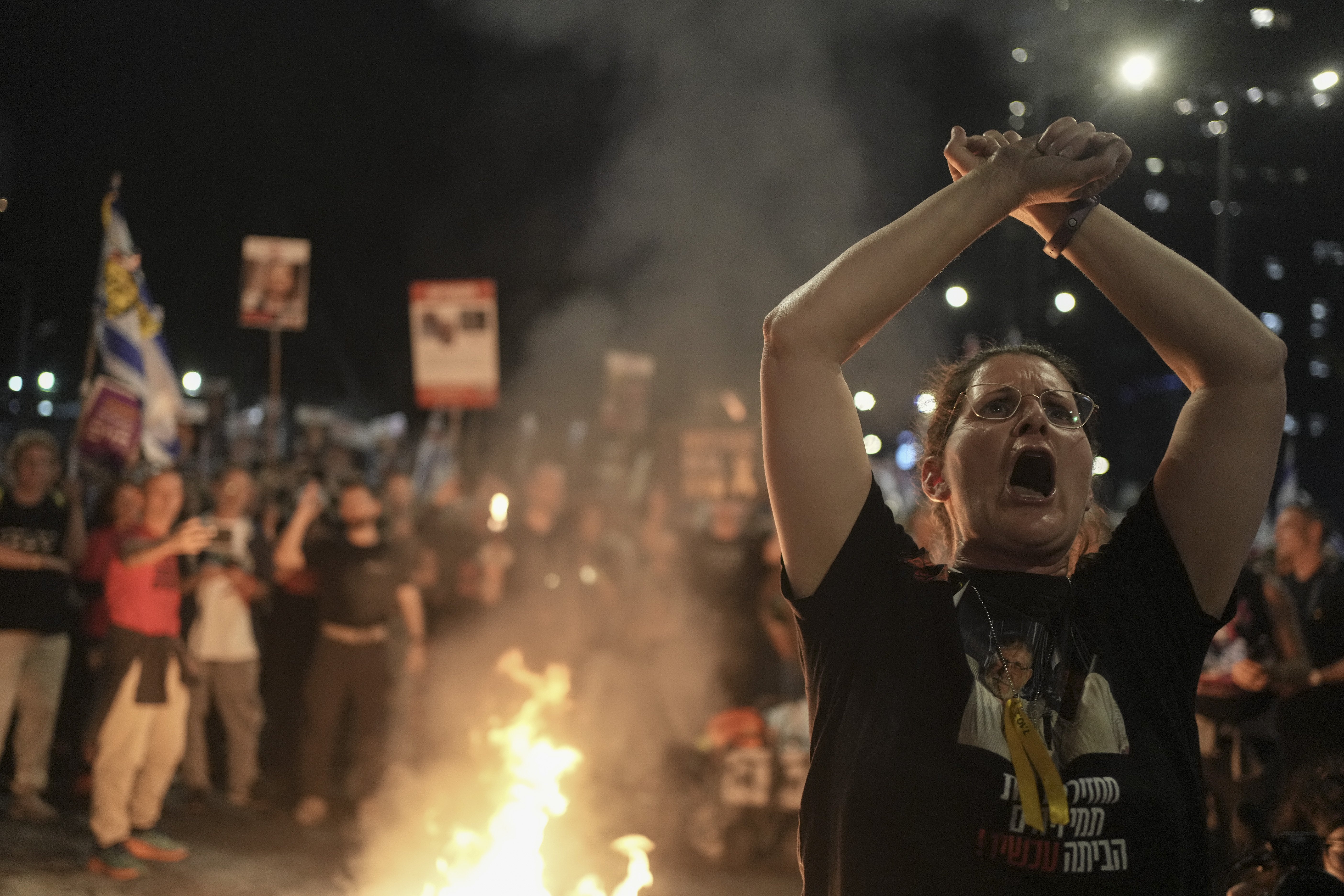 A woman takes part in a protest against Israeli Prime Minister Benjamin Netanyahu's government in Tel Aviv, Israel. Photo / AP