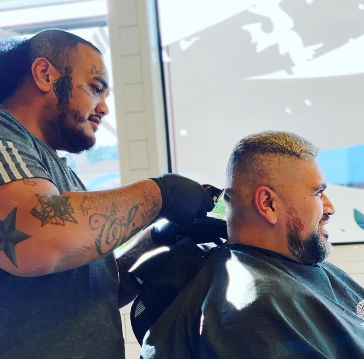 Nate Nauer posted this photo on social media of Jarome Fonua, a senior member of the Comancheros gang, giving him a haircut.
