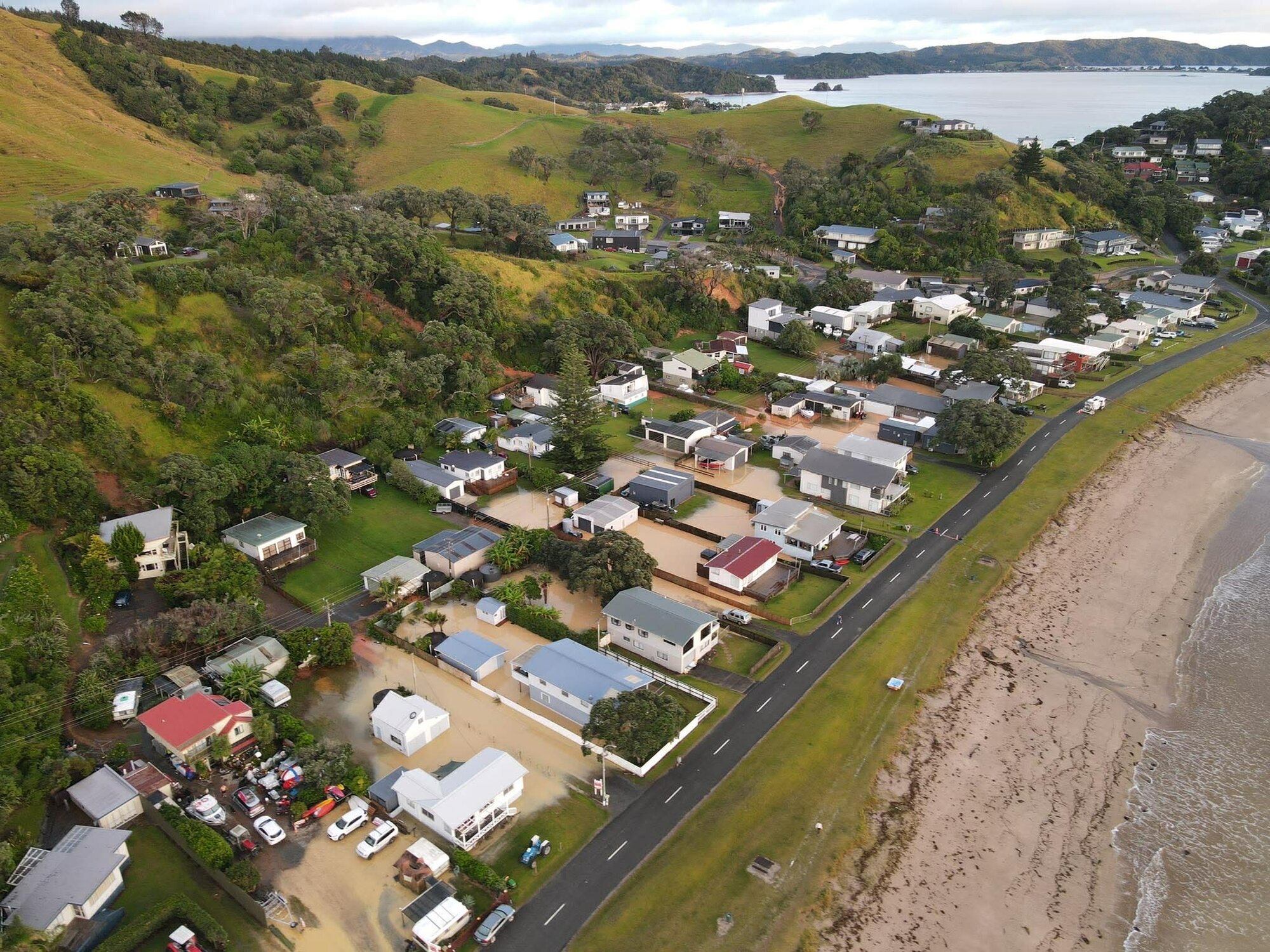 Slips swamp Ōakura settlement north-east of Whangārei after the weekend's weather bomb 