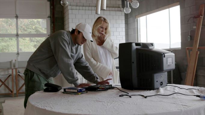 This image released by Netflix shows Pamela Anderson, right, and her son Brandon Thomas Lee in a scene from the documentary 