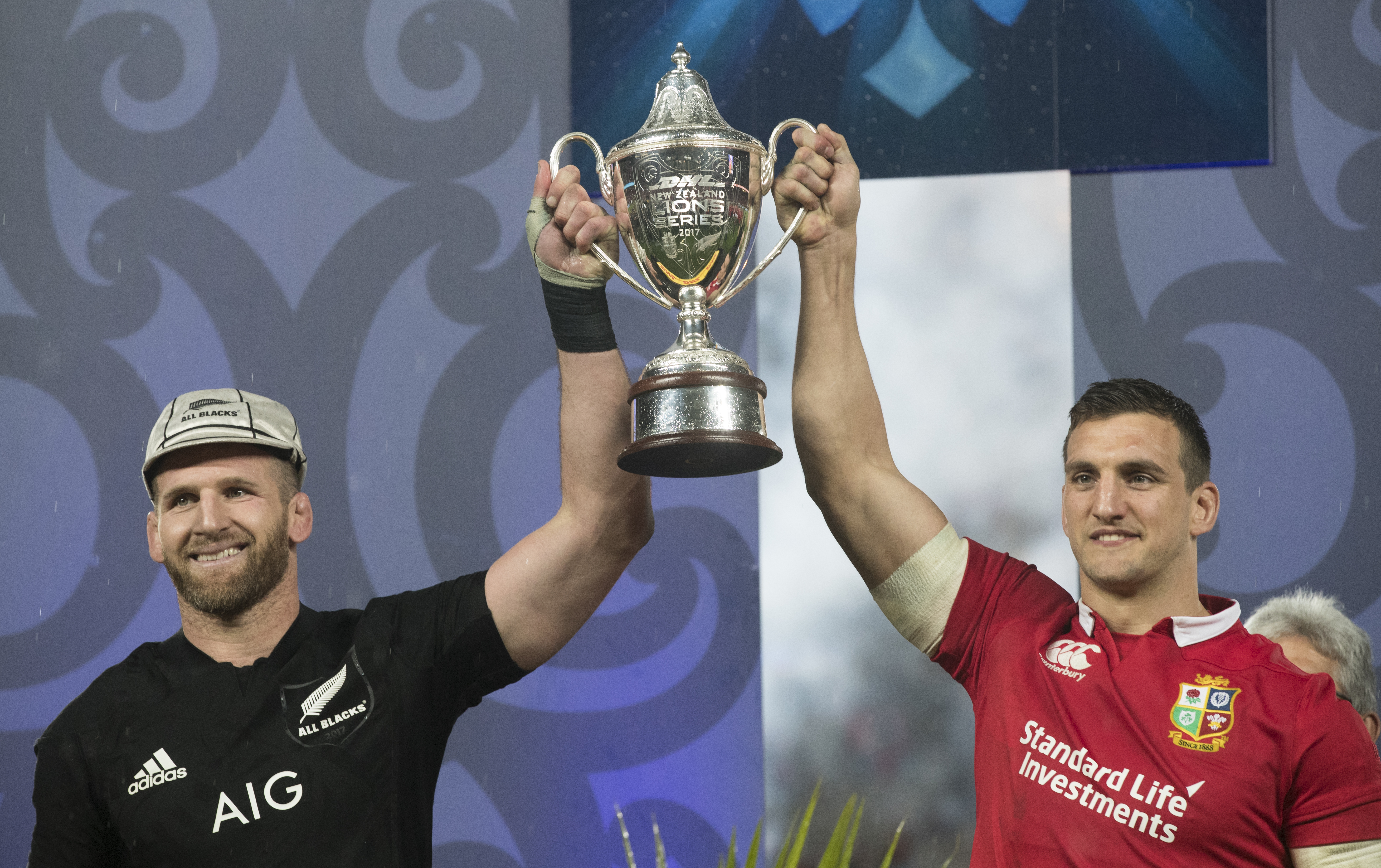All Blacks captain Kieran Read and Lions captain Sam Warburton with the Lions series trophy. Photo / Brett Phibbs