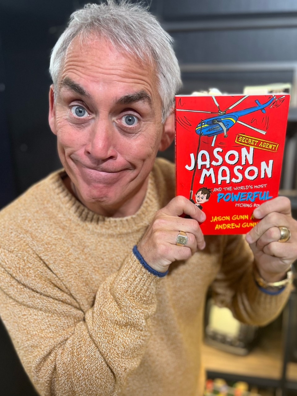 Jason Gunn with his new children's book, Jason Mason and the World's Most Powerful Itching Powder. Photo / Supplied