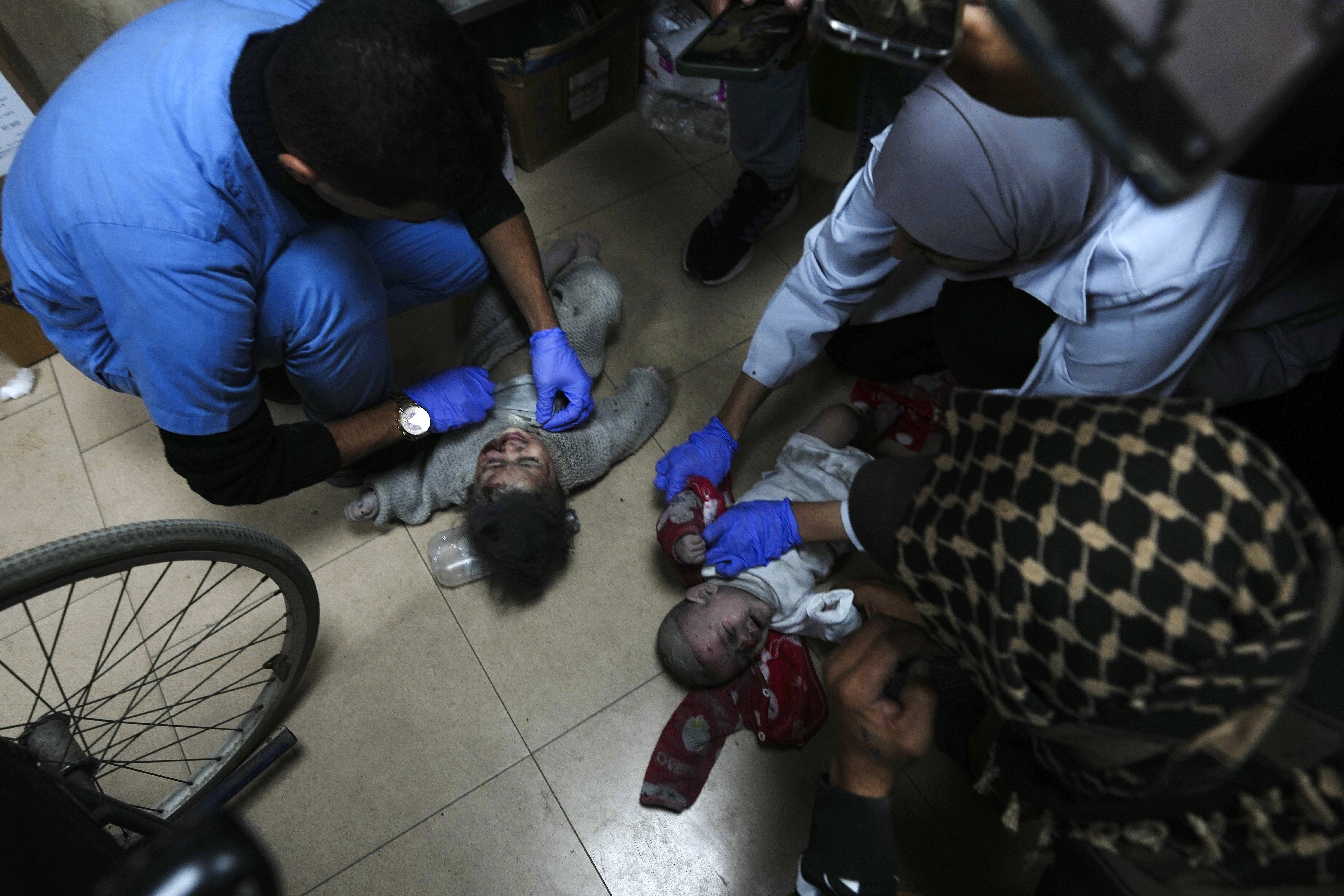Palestinians wounded in the Israeli bombardment of the Gaza Strip are brought to the hospital in Deir al Balah, Gaza Strip. Photo / AP