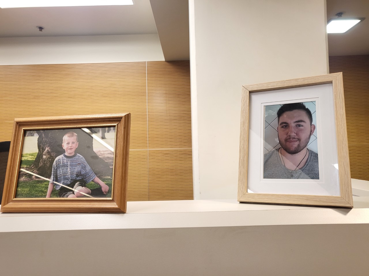 The photos of Jake Ginders (left) as a child and Floyd Harris, 21, are displayed during a coronial inquest into their deaths. Ginders was 23 when he died. Photo / Jeremy Wilkinson