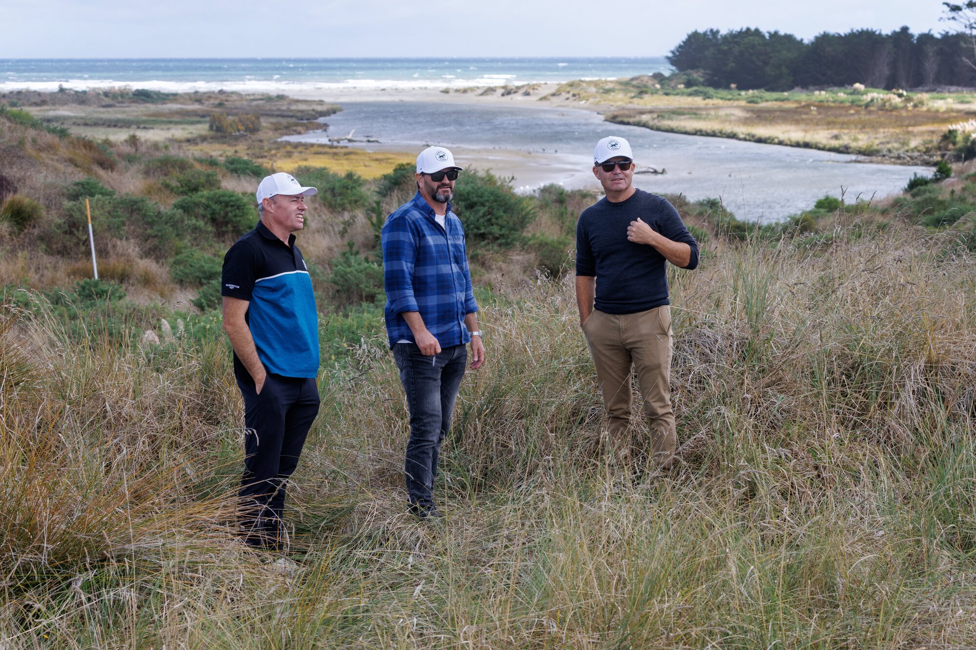 Tim Wilton, Hamish Edwards and Brendan Allen above the Ōhau River. The 14th hole of the planned Douglas Links golf course will be to the far right of the photo.  Photo / Mark Mitchell