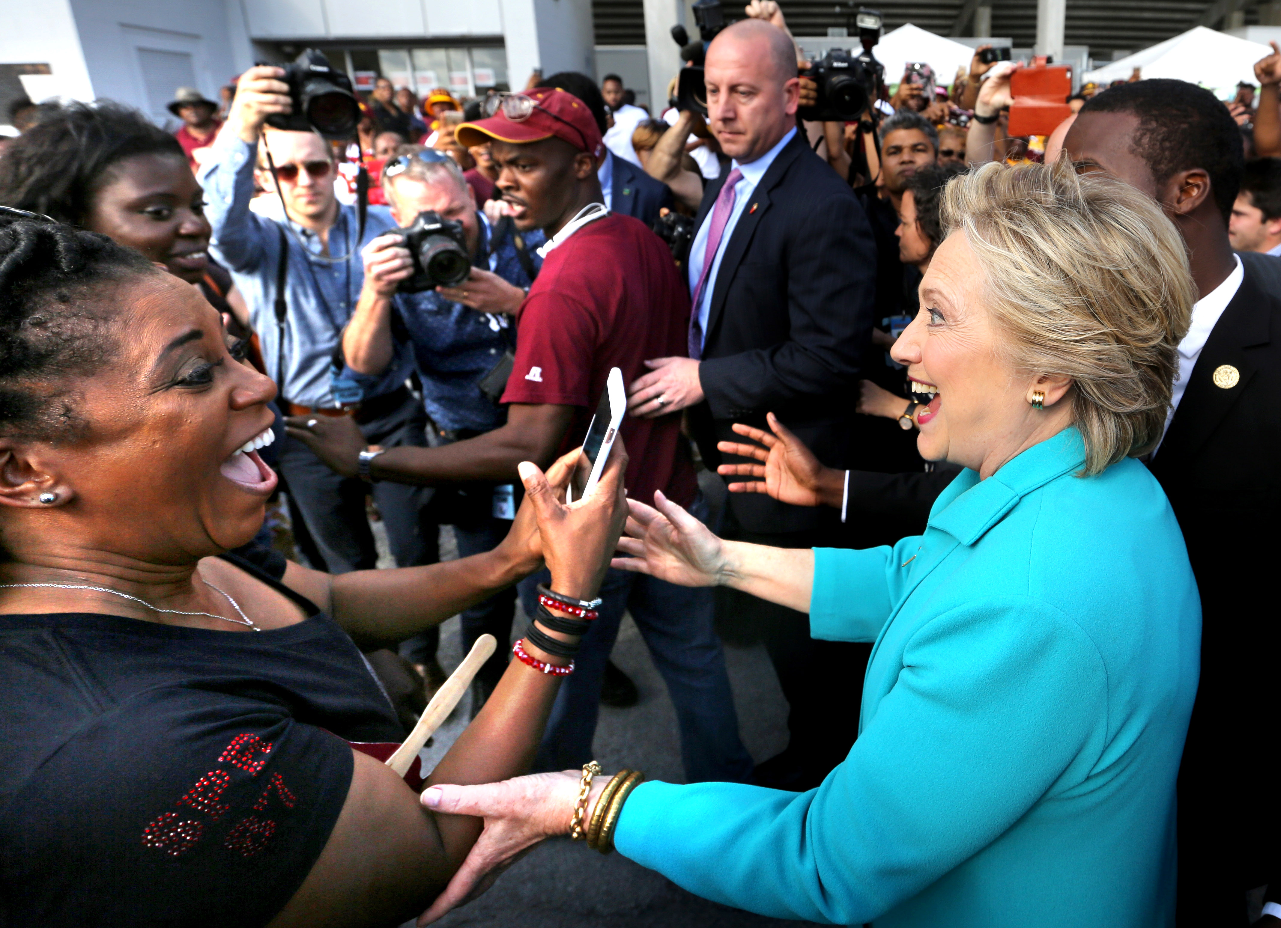 Hillary Clinton greets supporters as she makes her way through the crowd in Daytona Beach, Florida. Photo / AP