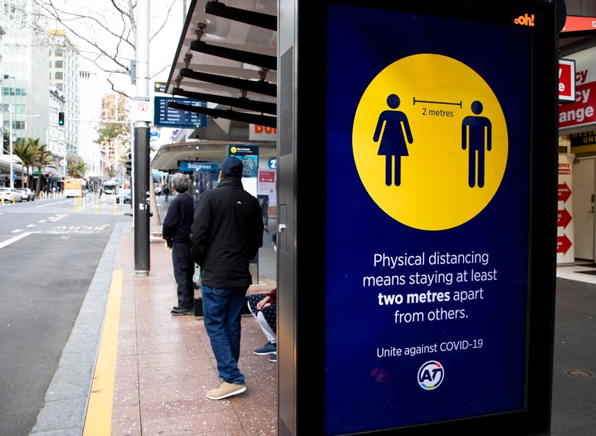 AT physical distancing sign on a bus stop, 2020. Photo / Dean Purcell