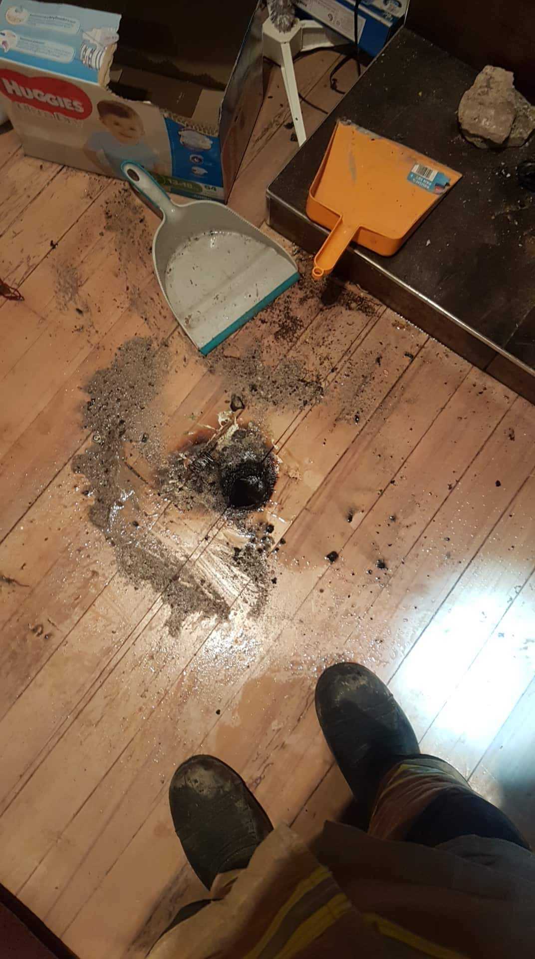 The unattended ashes from a fireplace burnt a hole in the wooden floor.
Photo/Supplied