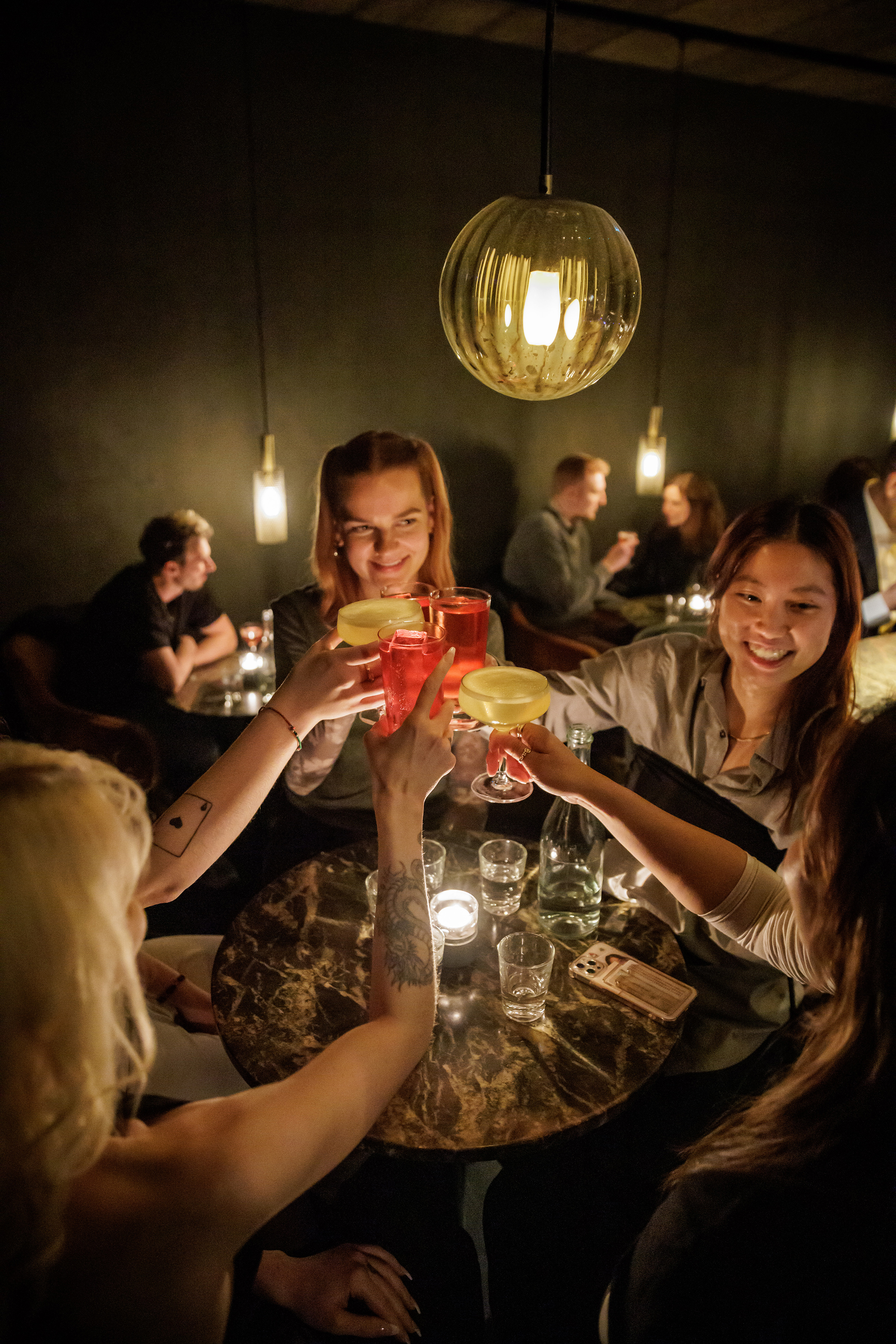 To enter the Truffle Pig Bar, in Berlin, guests press a button on what looks like a fire alarm and are led down a hallway. Photo / Gordon Welters, The New York Times
