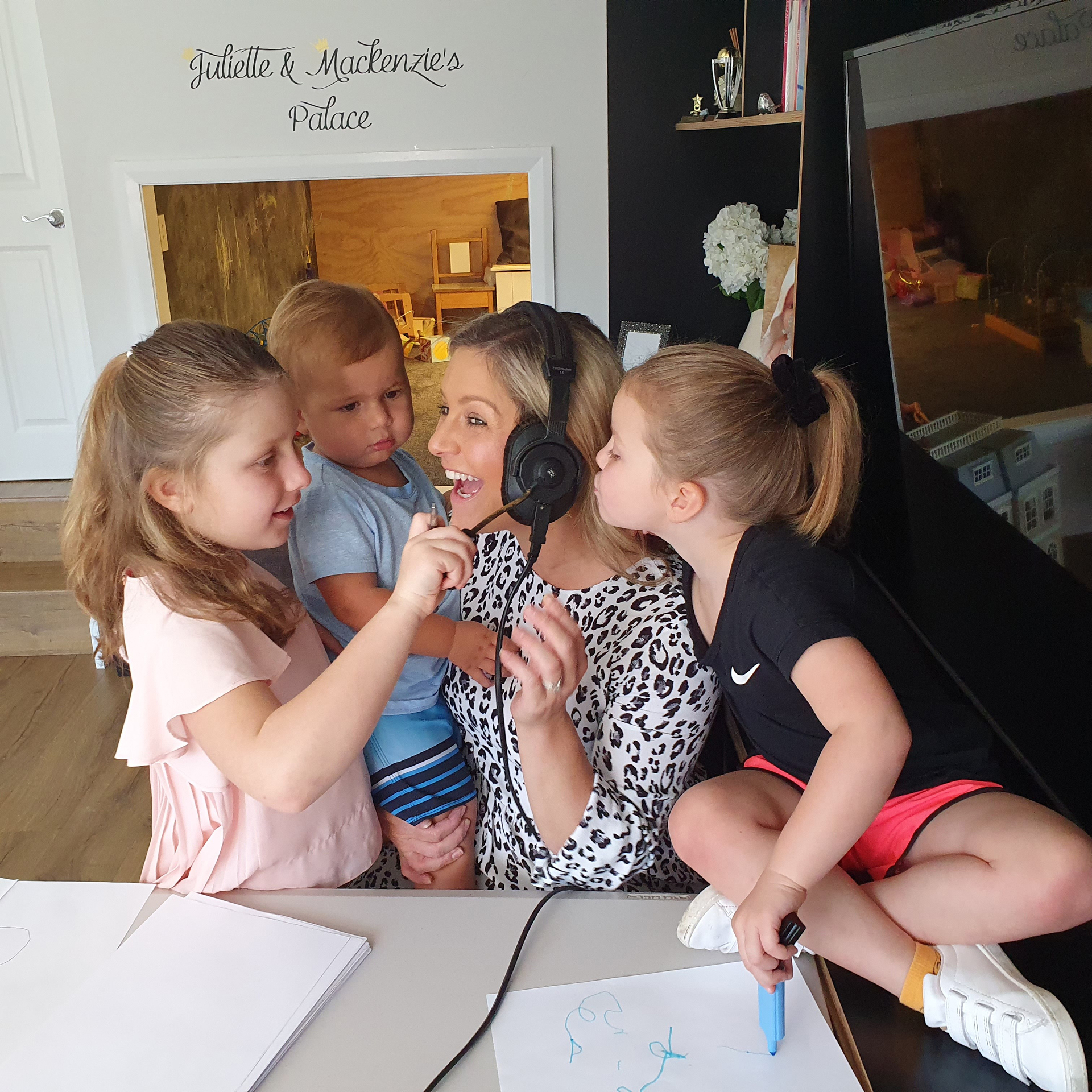 Coast presenter Toni Street broadcasting from her home during the Covid-19 restrictions last year with her children Juliette, Lachie and Mackenzie. Photo / Supplied