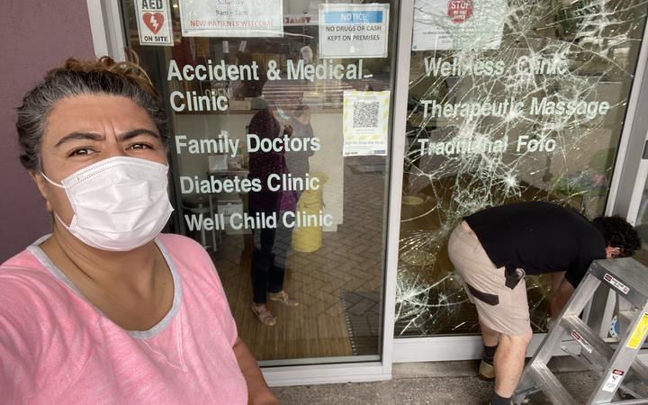 Josephine Bartley outside the Pasefika Family Health Group centre, which is also a Covid vaccine site, after it was vandalised. Photo / Twitter