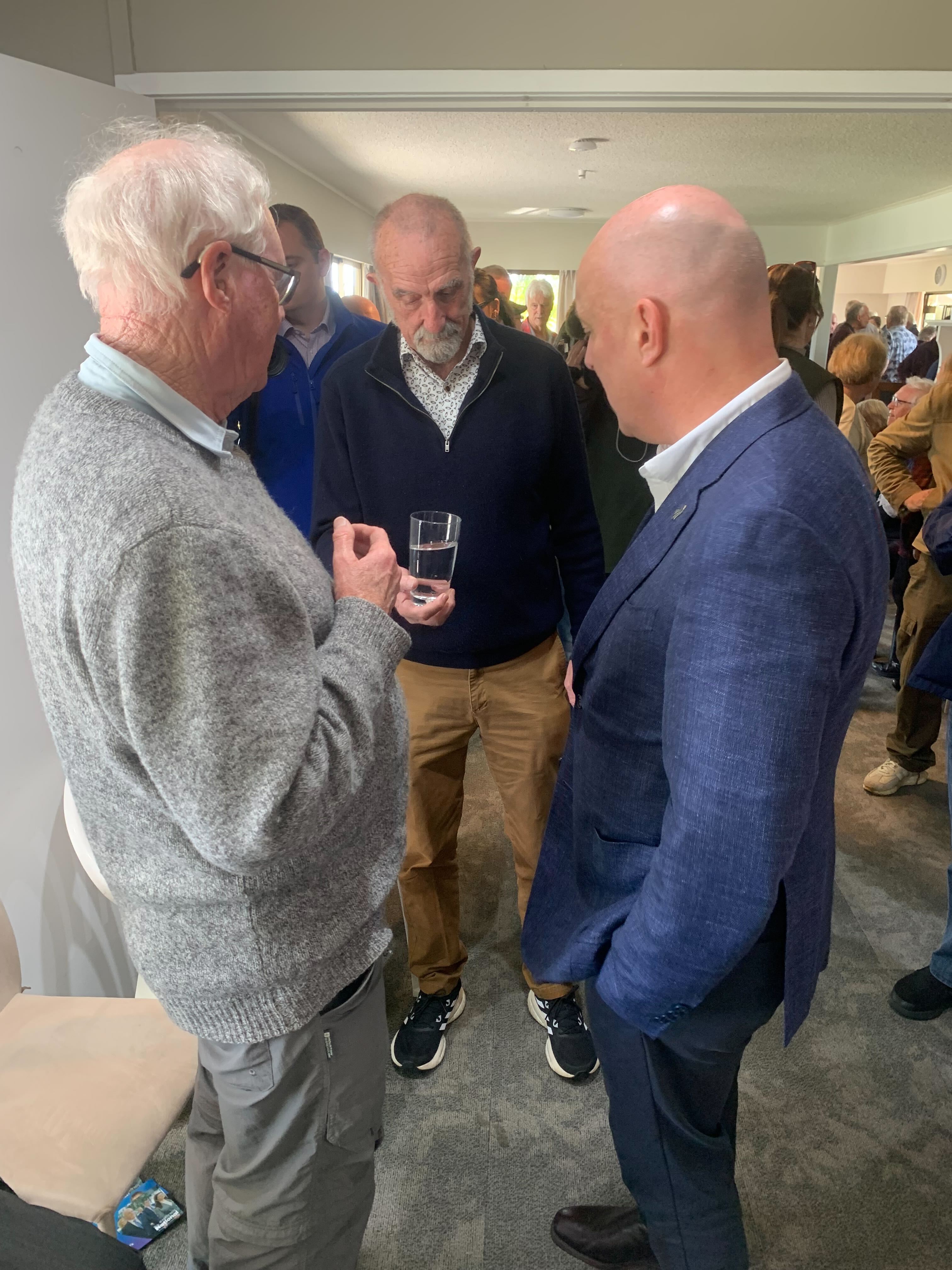 Former Far North mayor John Carter gets a glass of water for National's Christopher Luxon. Photo / Adam Pearse