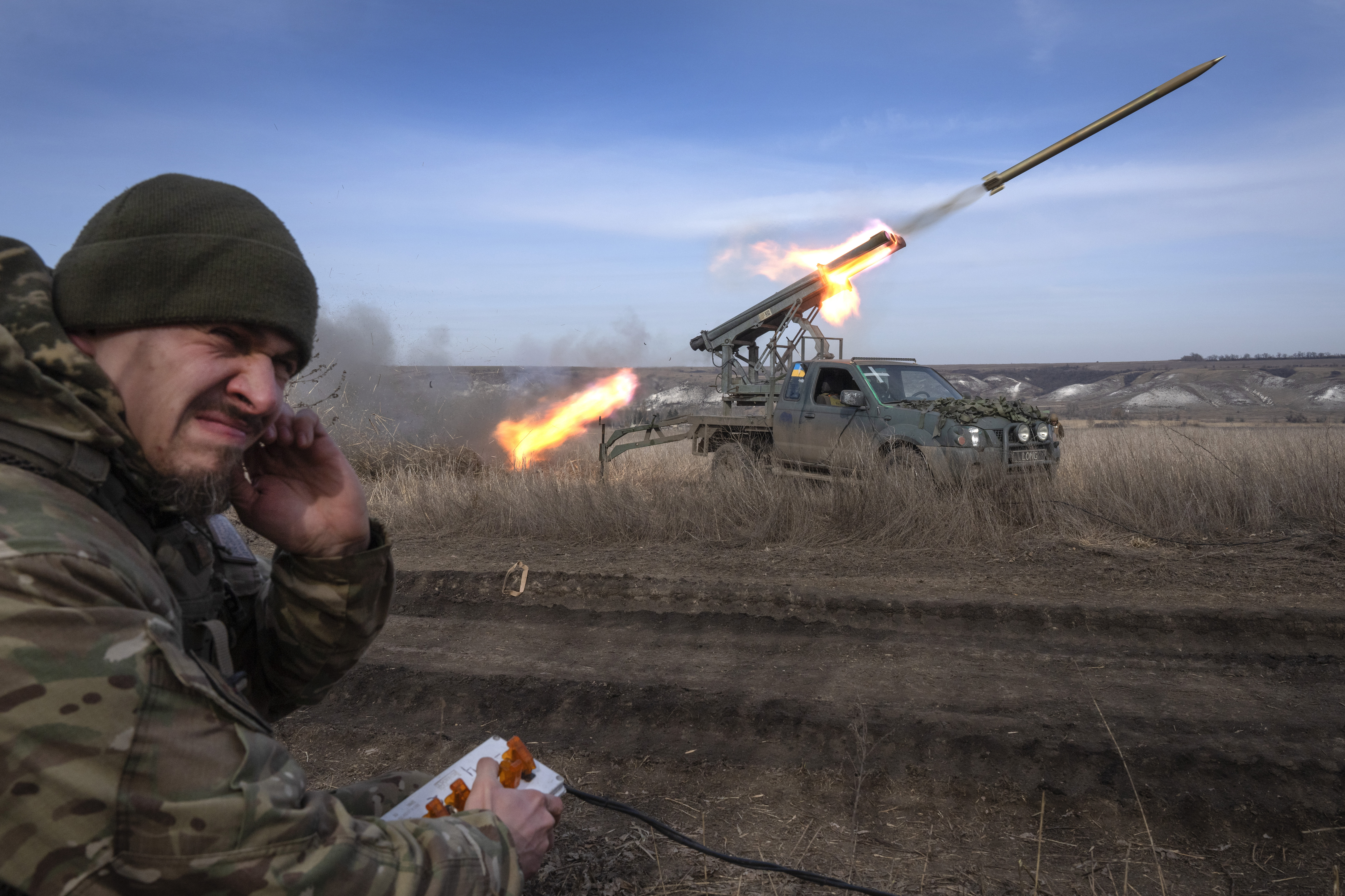 A Ukrainian officer from the 56th separate motorised infantry Mariupol brigade fires a multiple launch rocket system based on a ute towards Russian positions at the front line, near Bakhmut, Donetsk region. Photo / AP