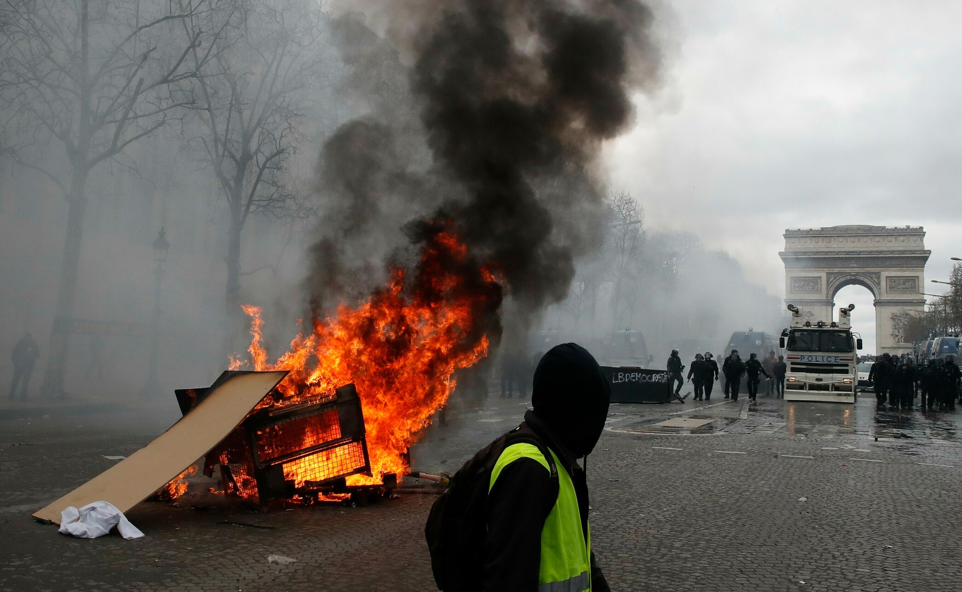 A barricade burns on the Champs Elysees in central Paris during a Yellow Vests demonstration on March 16, 2019. Photo / AP