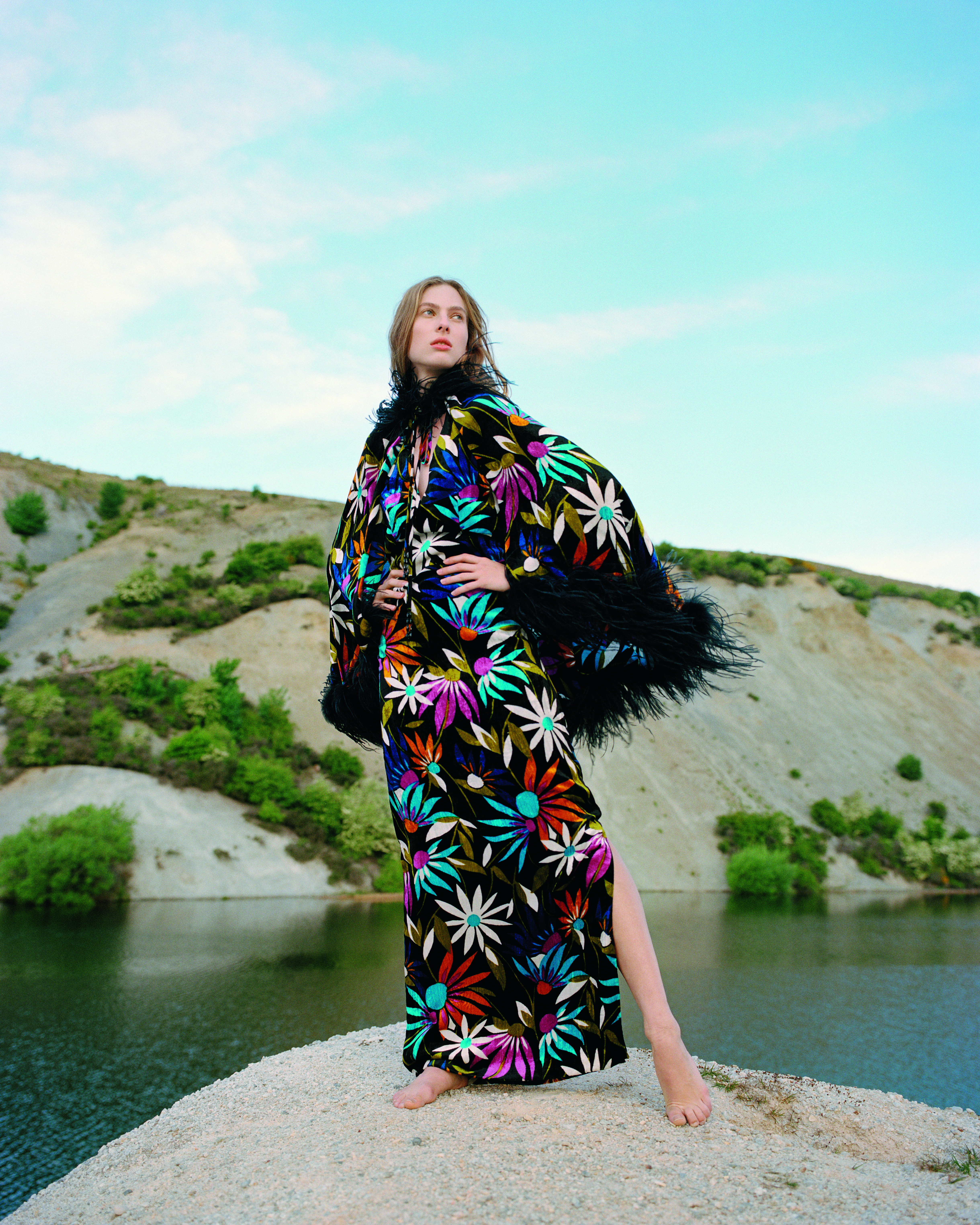 An early 1970s Vinka Lucas (Maree de Maru) halter neck dress and cape from the Eden Hore Central Otago collection. Model: Hannah Clarke, Photographed at Blue Lake, St Bathans, 2019. Photo/ © Derek Henderson, courtesy of Te Papa Press/Eden Hore Central Otago
