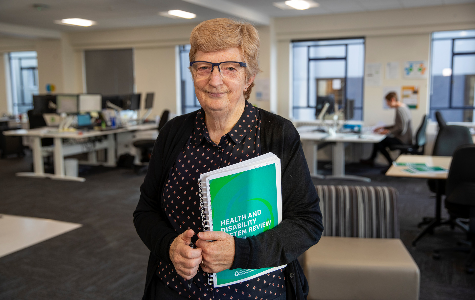 Heather Simpson, chairwoman of the Health and Disability review panel, with a copy of their report in Wellington. Photo /  Mark Mitchell
