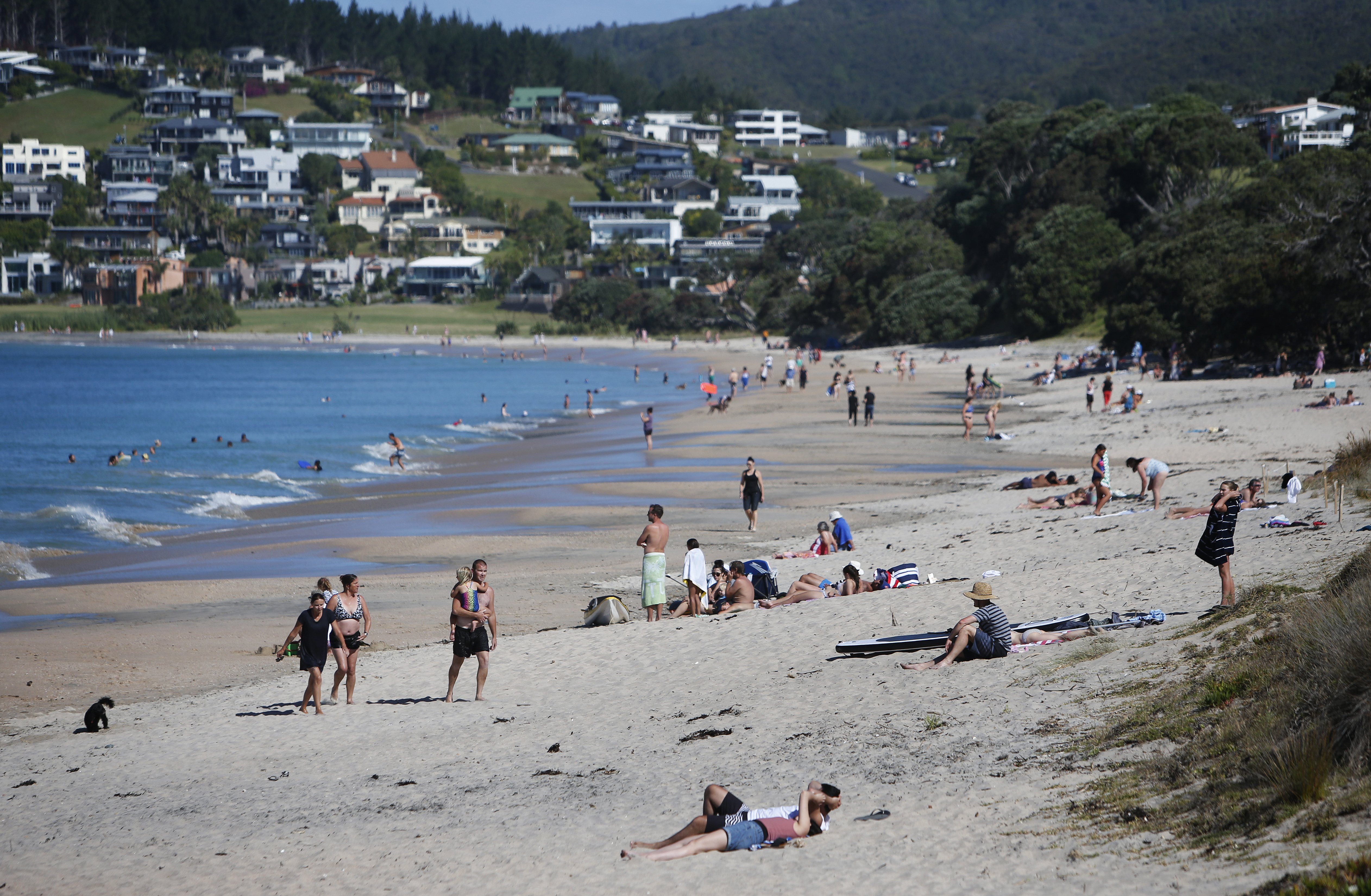 As in this photo of holidaymakers previously enjoying time out at Langs Beach between Christmas and New Years, the weather this festive season is not expected to be too intolerably hot.  Photo/Michael Cunningham