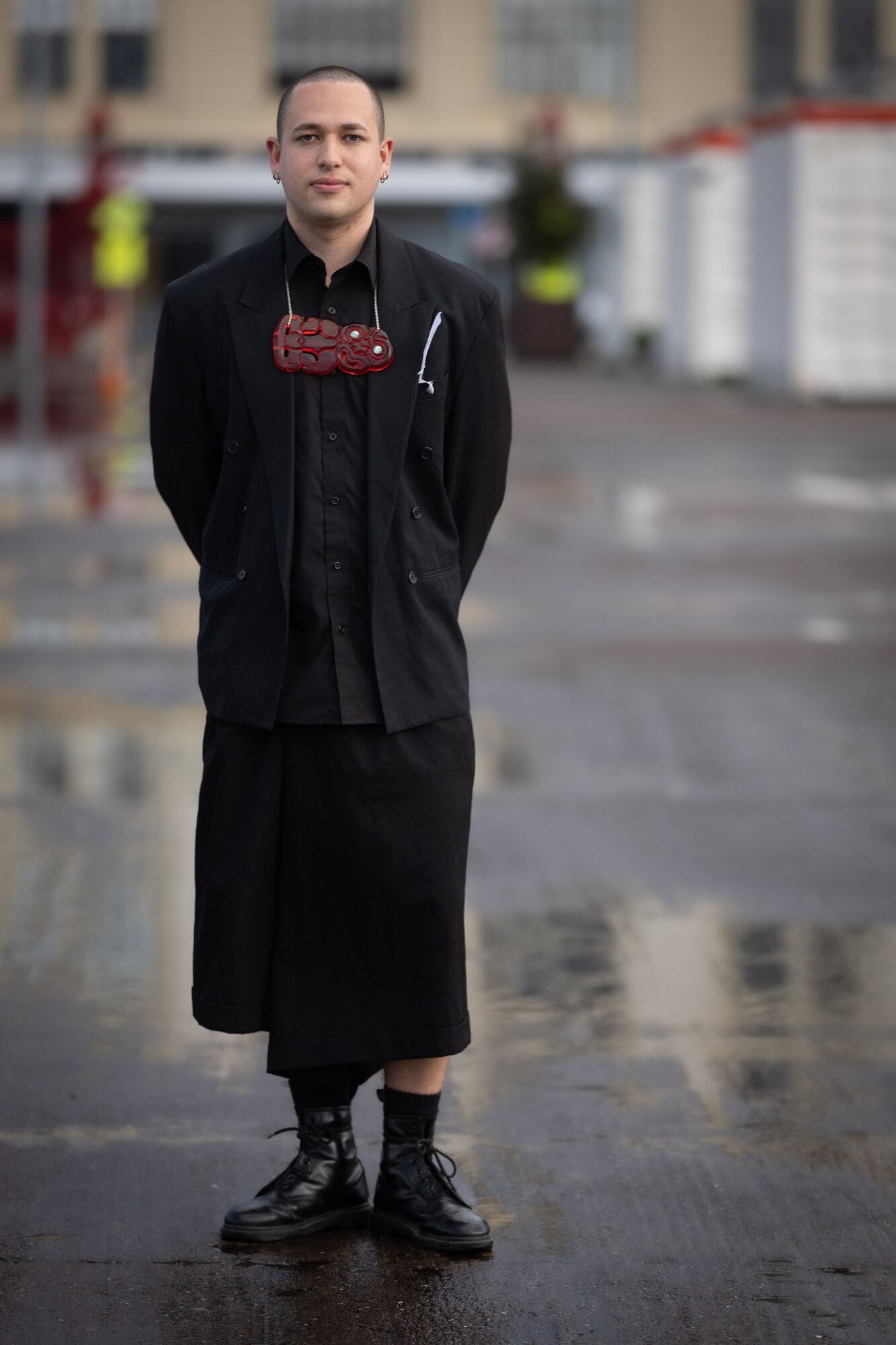 Vince Ropitini wears a CDG skirt, thirfted shirt and blazer with a Messini Palace hei tiki. Photo / Michael Craig