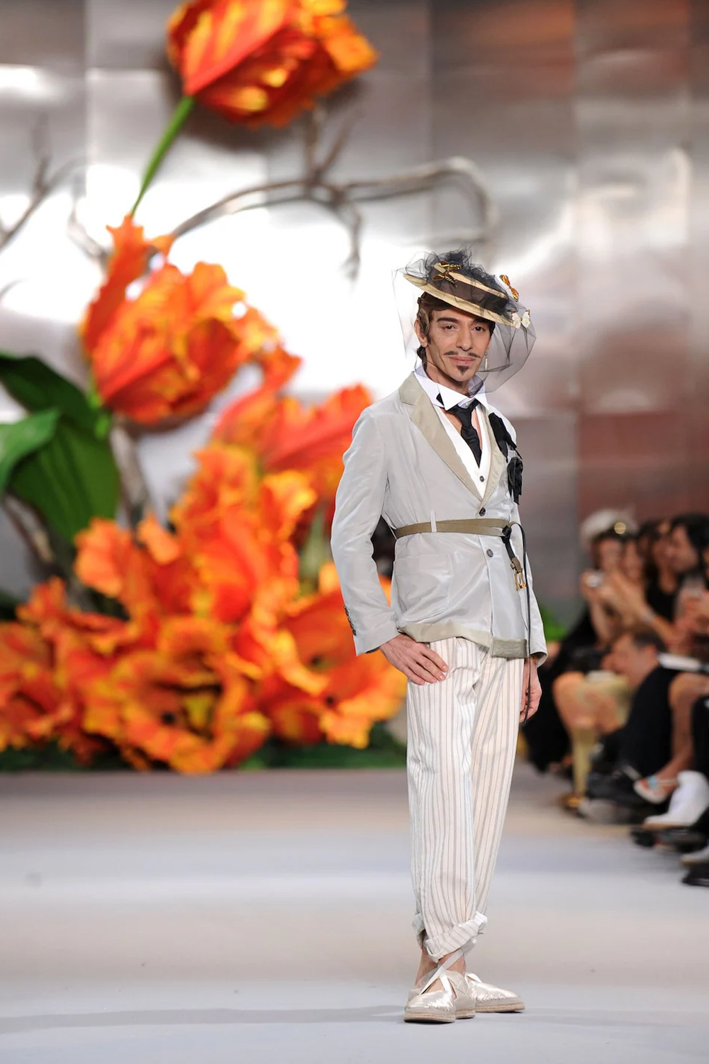 John Galliano, pictured in 2010, on the runway at the end of the Christian Dior show in Paris. Photo / Getty Images