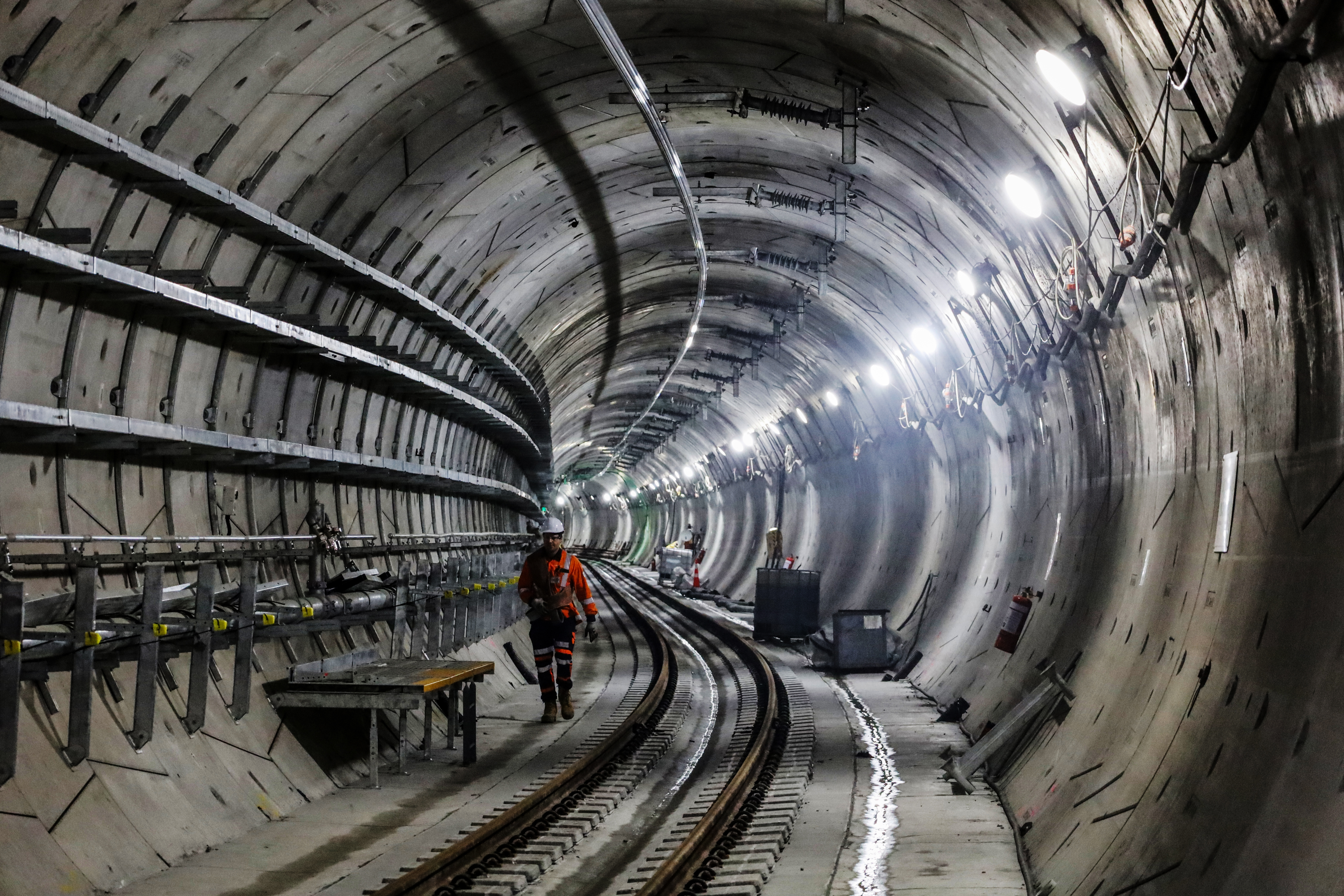 A tunnel fitted out with rail tracks, overhead power and trays for cabling. Photo / Jed Bradley.