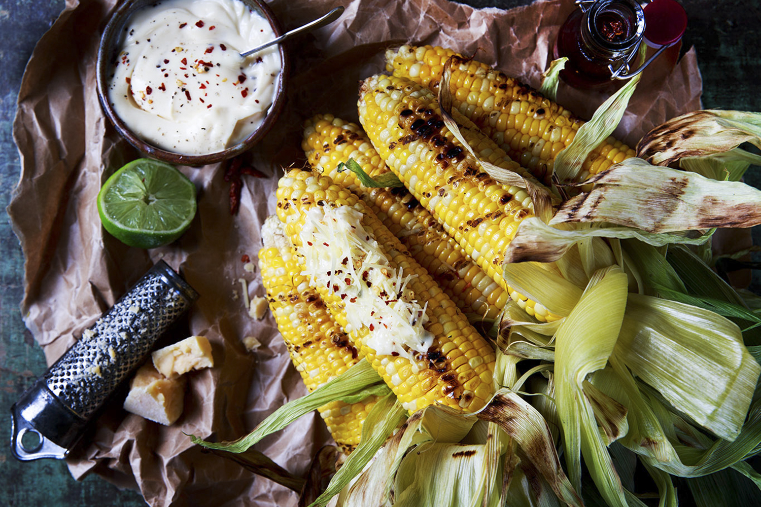 Scorched corn with mayo, chilli and parmesan. Photo / Babiche Martens