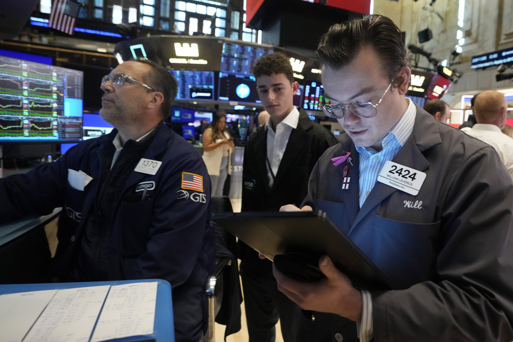 Traders on the floor of the New York Stock Exchange, where stocks just had their best day since November 6, the day after the US election. Photo / AP