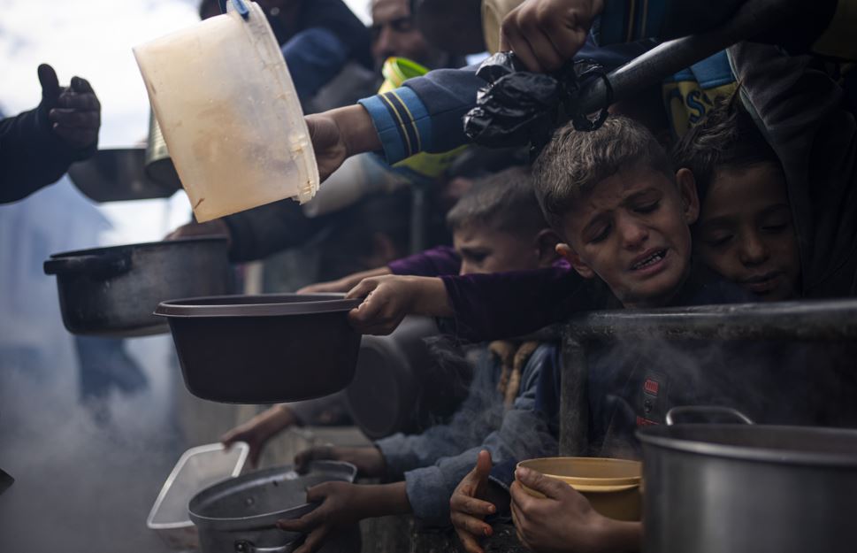 Palestinians line up for a free meal in Rafah, Gaza Strip. Photo / AP