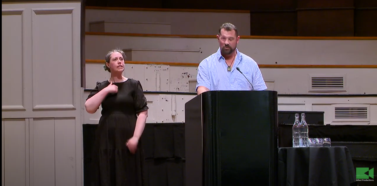 Former All Black Paul Miller, who lost his right eye to cancer, spoke at the rally in Dunedin on Monday. Image / YouTube