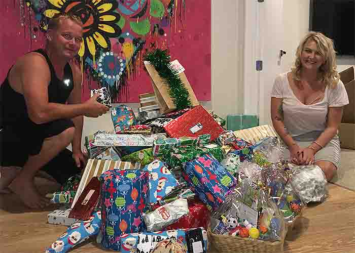 Tamzyn and Ben Adding pictured with gifts for those in need at Christmas in 2017. Photo / Heath Moore