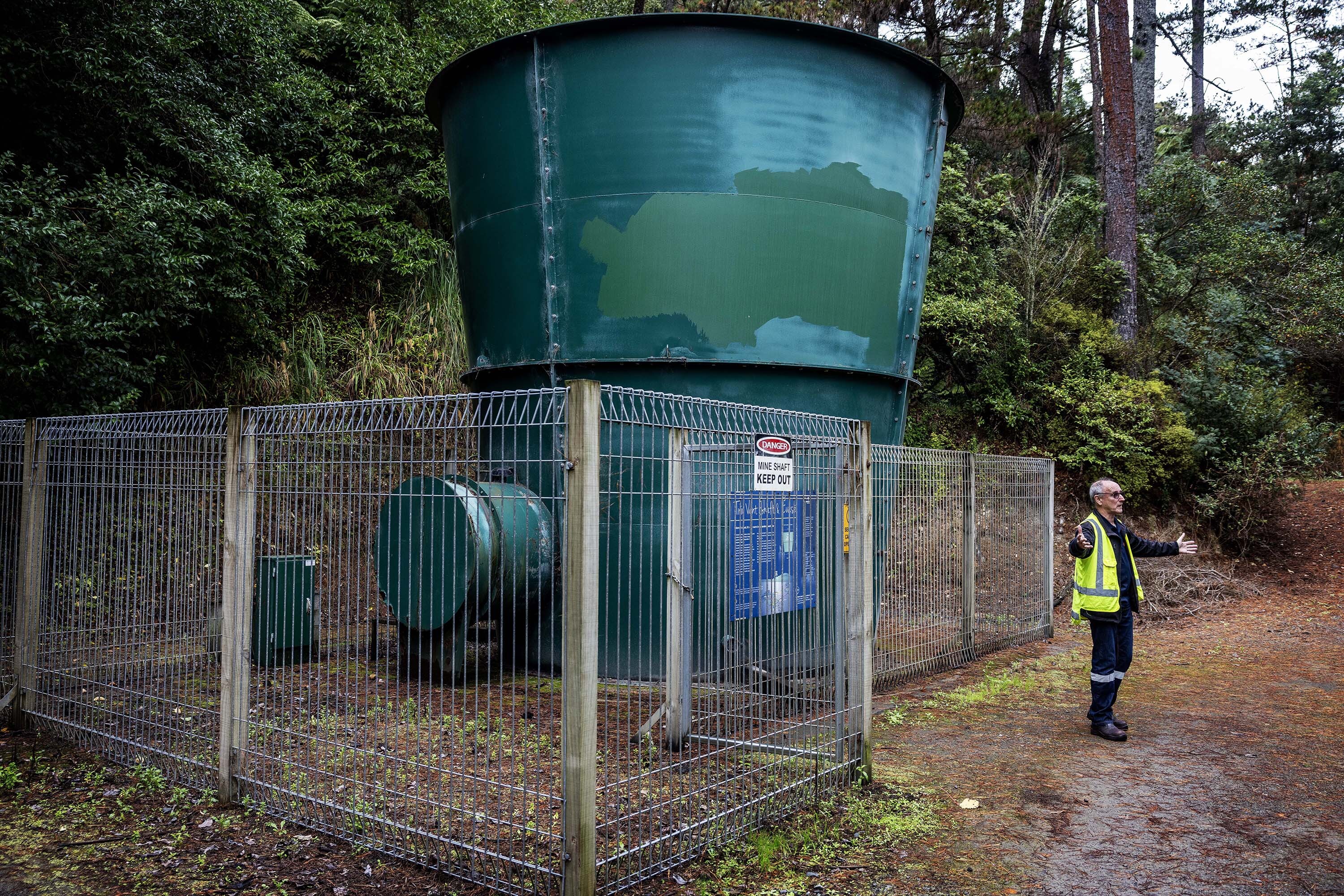 OceanaGold spokesman Kit Wilson stands next to a vent. Four similar structures would need to be placed on conservation land in the Coromandel, below which would be a tunnel and gold mine. Photo / Mike Scott