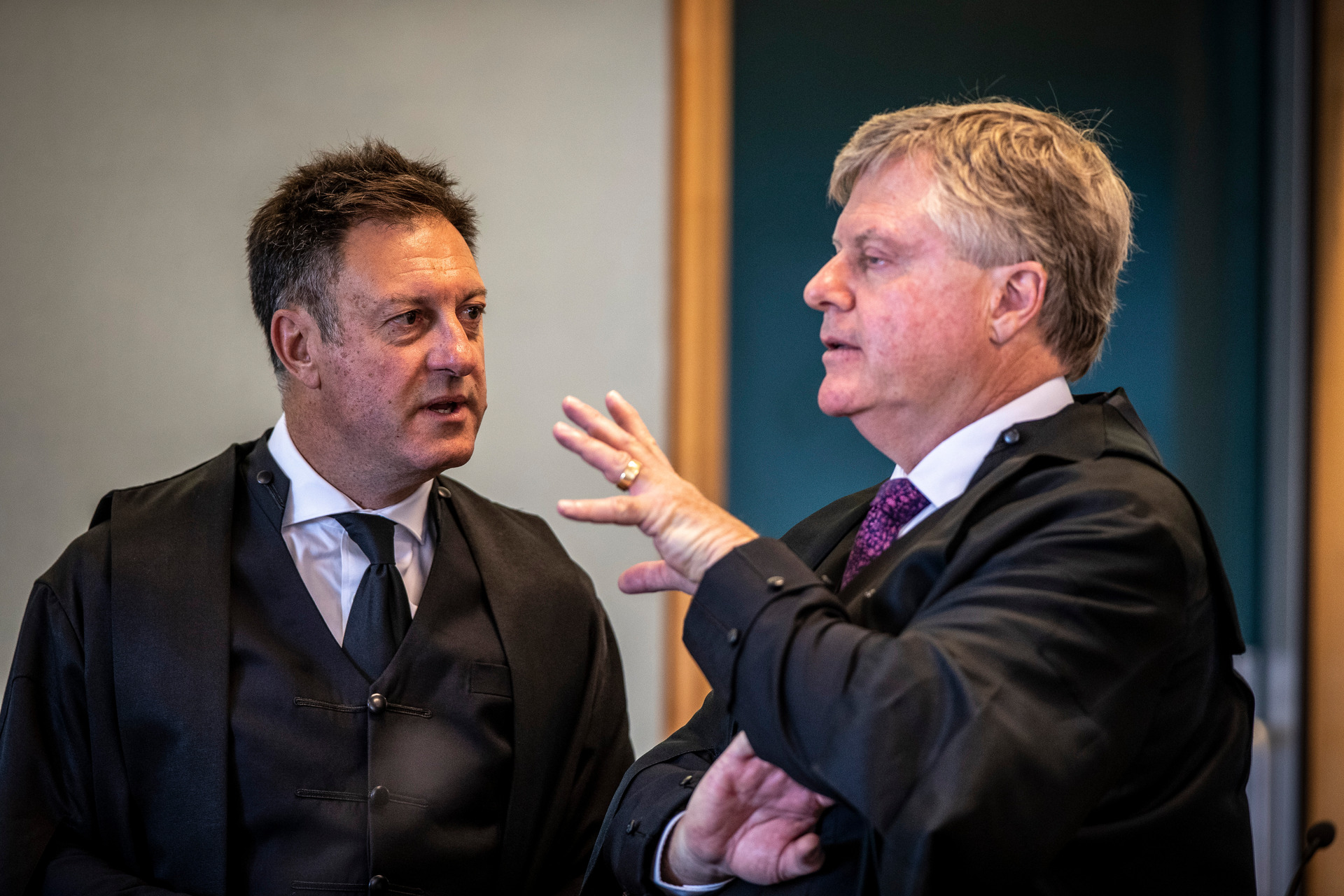 Crown Prosecutor Simon Foote QC talks to defence lawyer David Jones QC about the case on day one of the trial. Photo / Michael Craig